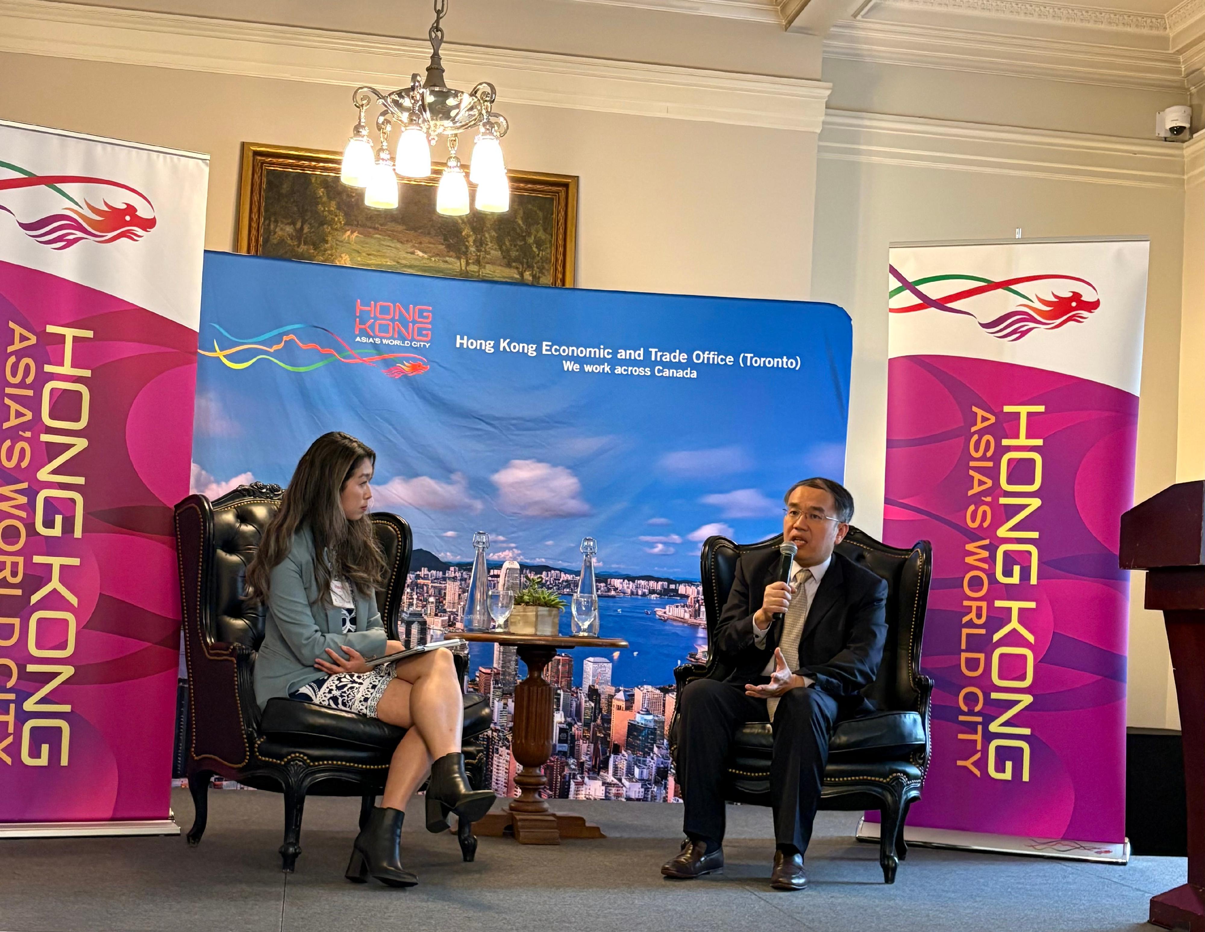 The Secretary for Financial Services and the Treasury, Mr Christopher Hui (right), attended a business luncheon orgranised by the Hong Kong-Canada Business Association (Vancouver Chapter) in Vancouver, Canada, on May 29 (Vancouver time). Photo shows Mr Hui having a fireside chat with Partner of Global Infrastructure Advisory of KPMG Ms Vivian Chan (left) to enlighten attendees on the latest financial developments in Hong Kong.