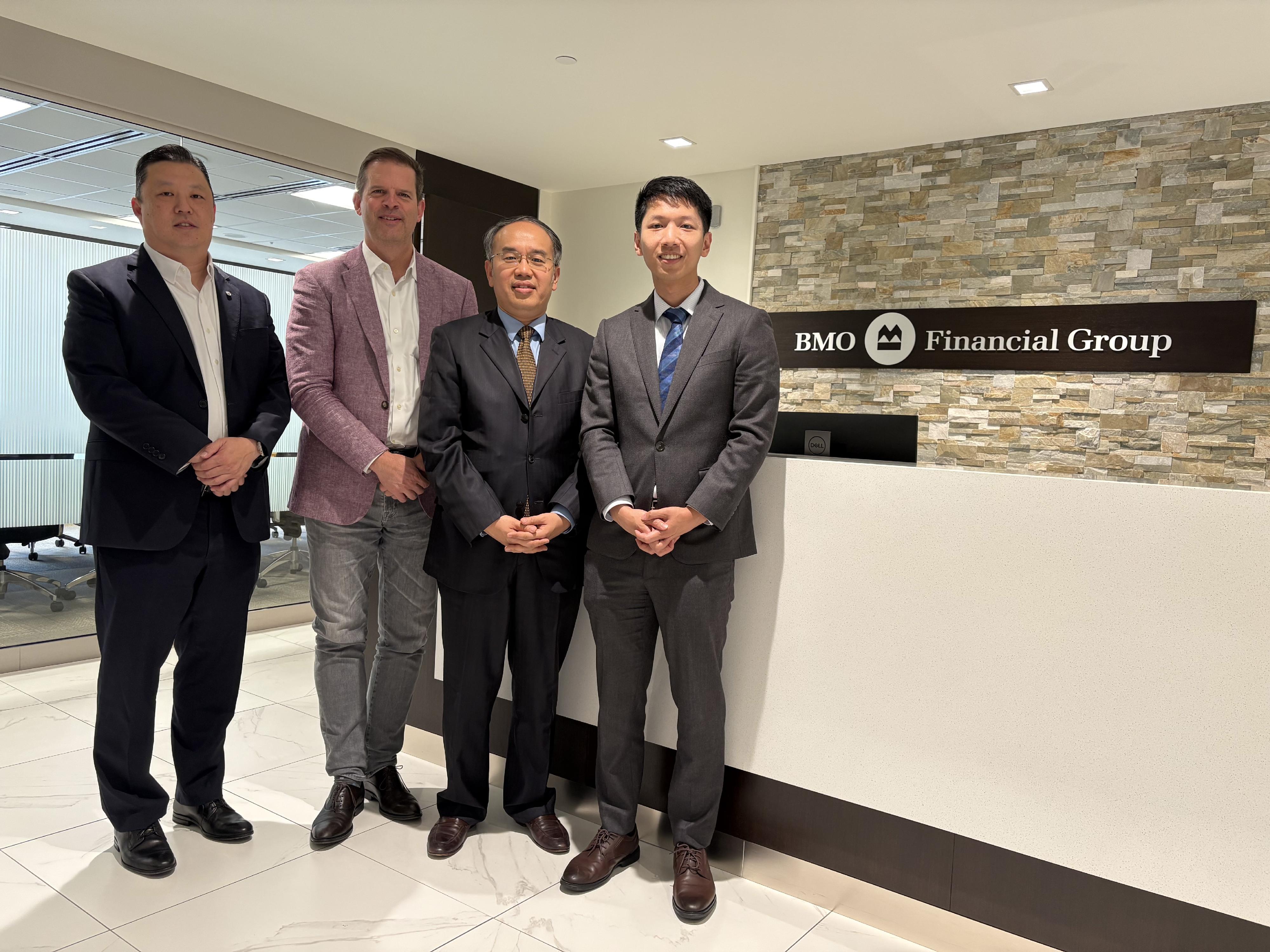 The Secretary for Financial Services and the Treasury, Mr Christopher Hui (second right), visited Bank of Montreal and met with the Senior Vice President & Head, Mid-Market, Commercial Bank, Mr Andrew Hung (first left), and Senior Vice President & Head, BC & Yukon, Mr Greg Vriend (second left), in Vancouver, Canada, on May 30 (Vancouver time). Next to Mr Hui is the Acting Director, Hong Kong Economic and Trade Office (Toronto), Mr Gavin Yeung (first right).