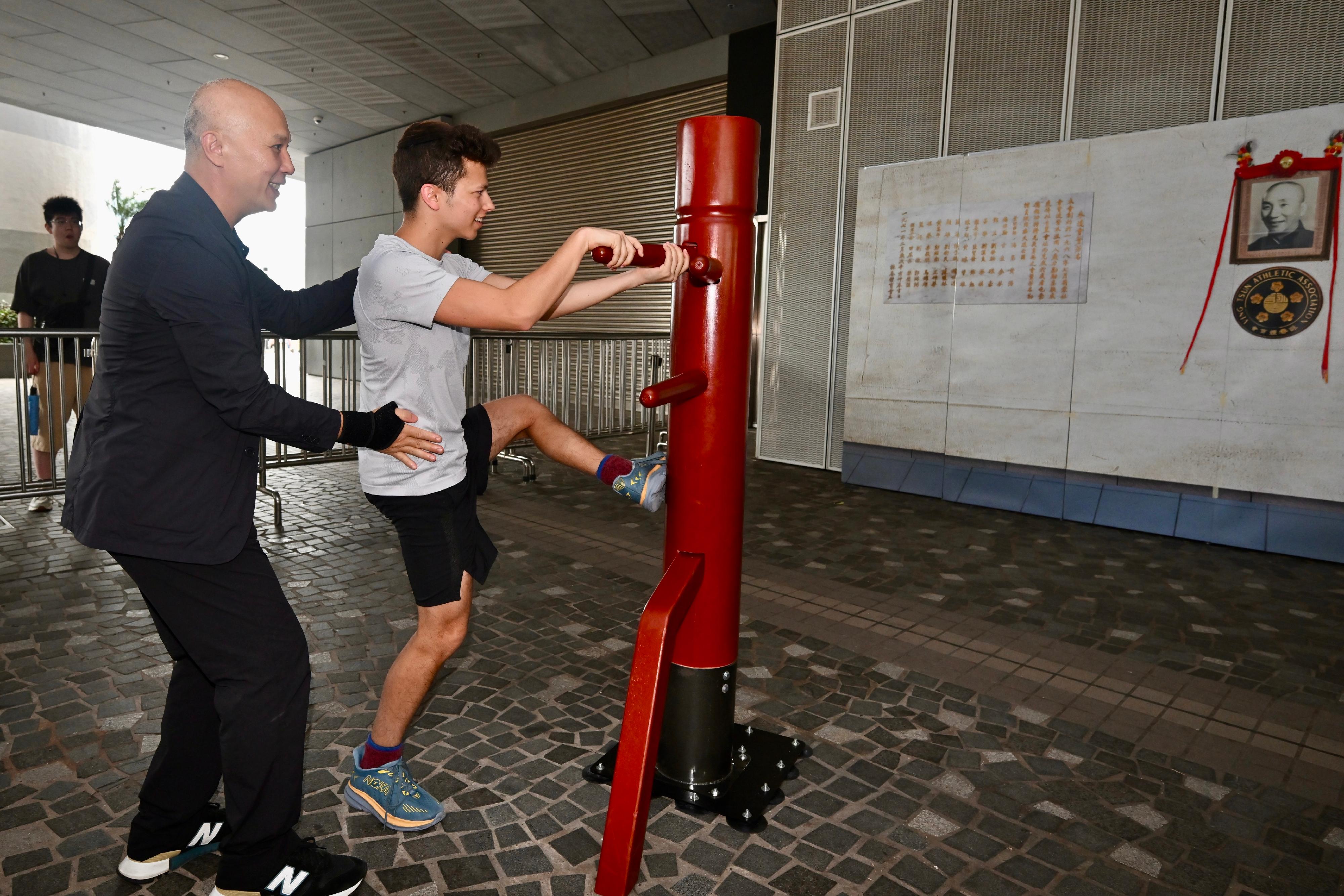 The Intangible Cultural Heritage Office is organising an Intangible Cultural Heritage Carnival today and tomorrow (May 31 to June 1) at the Hong Kong Cultural Centre Piazza. Photo shows a tourist experiencing Yip Man Wing Chun. 