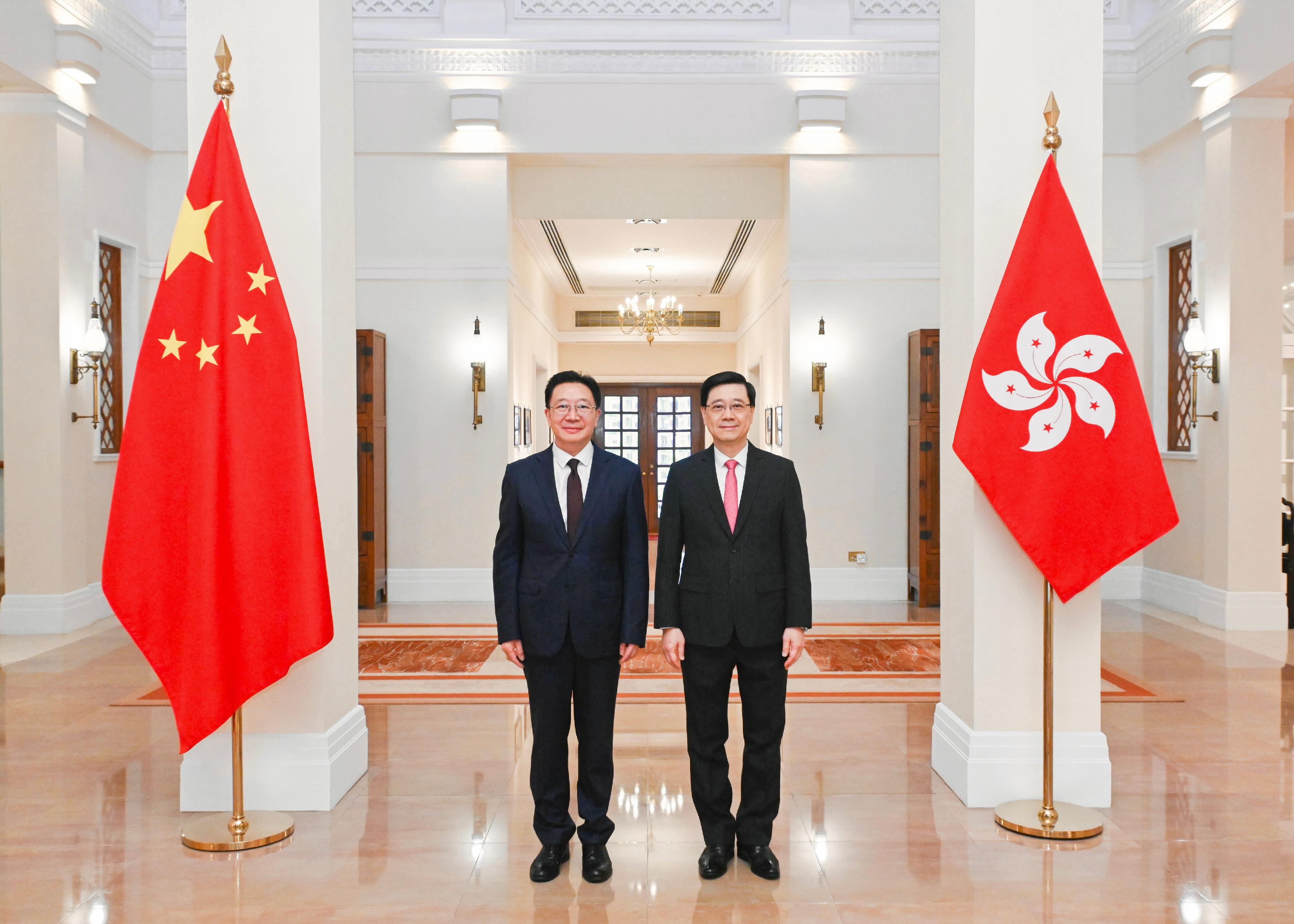 The Chief Executive, Mr John Lee (right), met with the new Director of the Liaison Office of the Central People's Government in the Hong Kong Special Administrative Region and National Security Adviser to the Committee for Safeguarding National Security of the Hong Kong Special Administrative Region, Mr Zhou Ji (left), at Government House today (May 31). 
