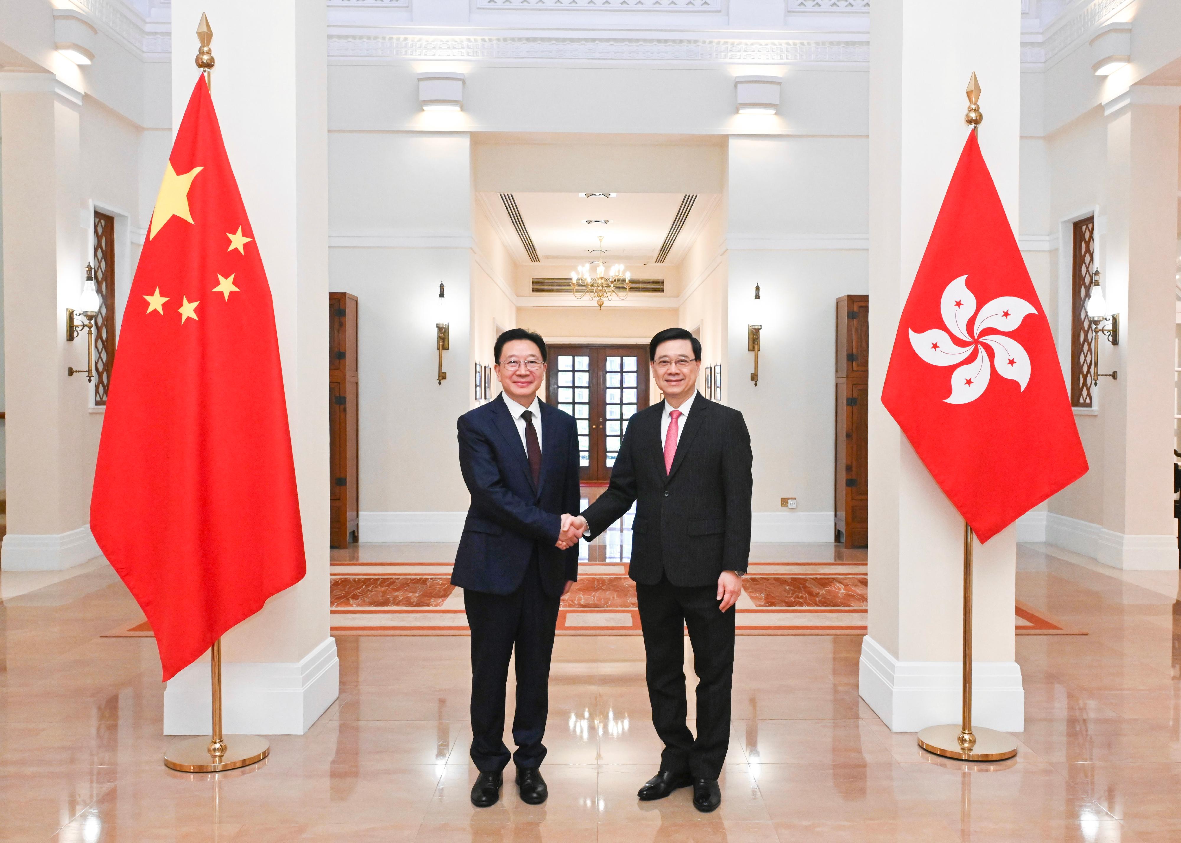 The Chief Executive, Mr John Lee (right), met with the new Director of the Liaison Office of the Central People's Government in the Hong Kong Special Administrative Region and National Security Adviser to the Committee for Safeguarding National Security of the Hong Kong Special Administrative Region, Mr Zhou Ji (left), at Government House today (May 31). 

