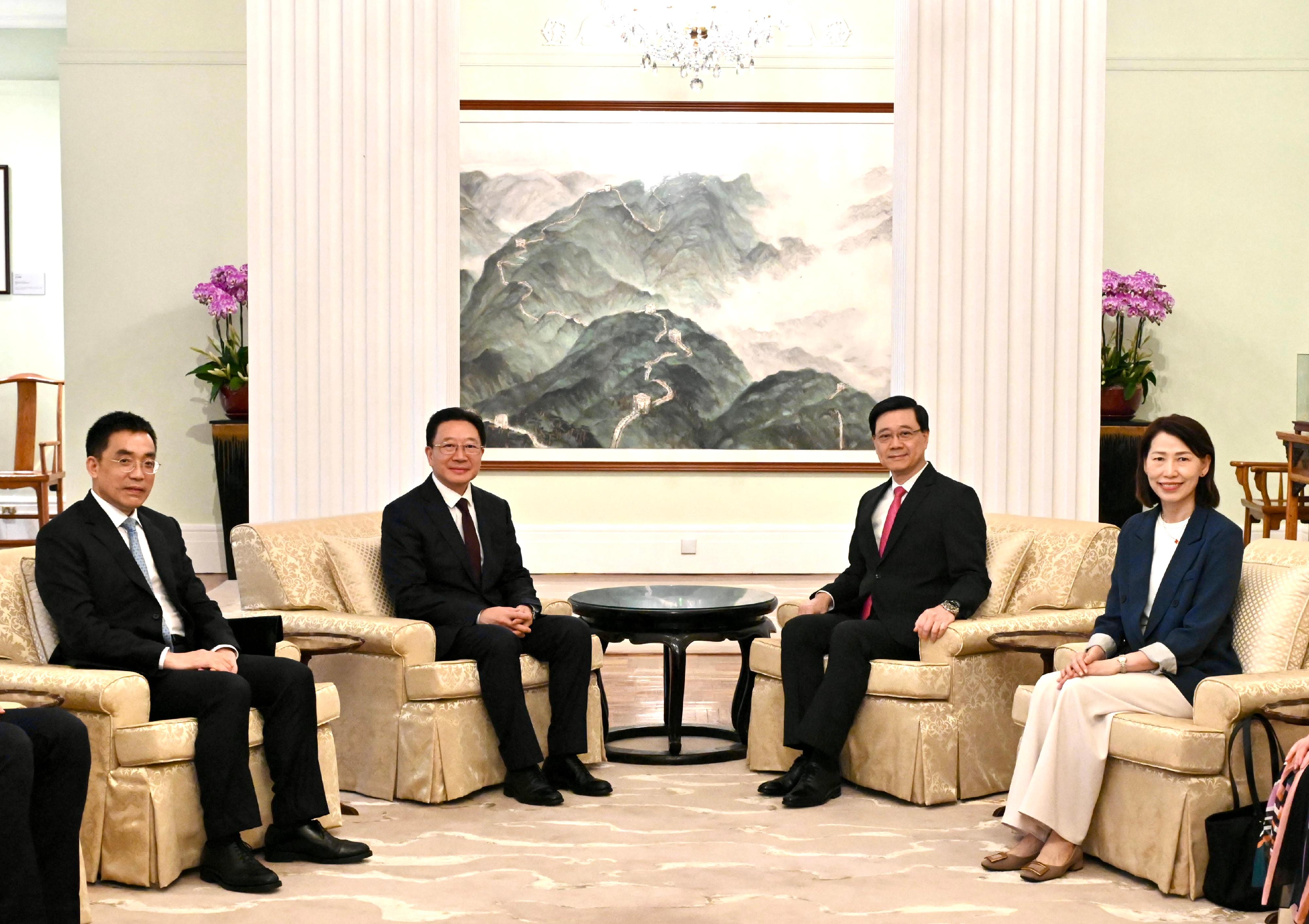 The Chief Executive, Mr John Lee (second right), met with the new Director of the Liaison Office of the Central People's Government in the Hong Kong Special Administrative Region (LOCPG) and National Security Adviser to the Committee for Safeguarding National Security of the Hong Kong Special Administrative Region, Mr Zhou Ji (second left), at Government House today (May 31). Also attending the meeting were the Director of the Chief Executive’s Office, Ms Carol Yip (first right), and the Deputy Secretary General and director-general of the general office of the LOCPG, Mr Xiao Youmei (first left). 
