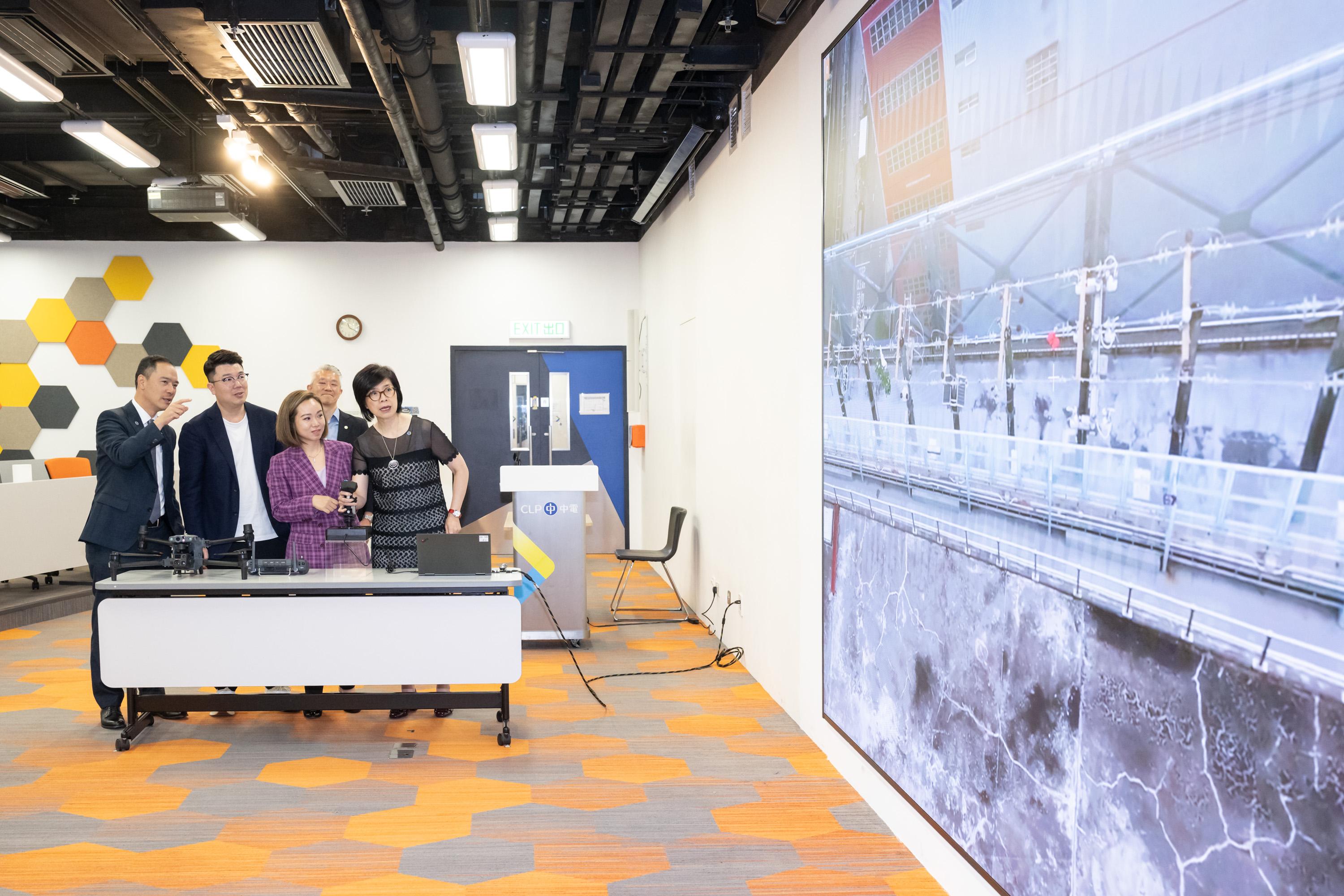 The Legislative Council Panel on Environmental Affairs visited the CLP Power Hong Kong Limited's (CLP) Shatin Centre today (June 3). Photo shows Members watching a demonstration of a CLP "beyond visual line of sight" drone inspecting power facilities.
