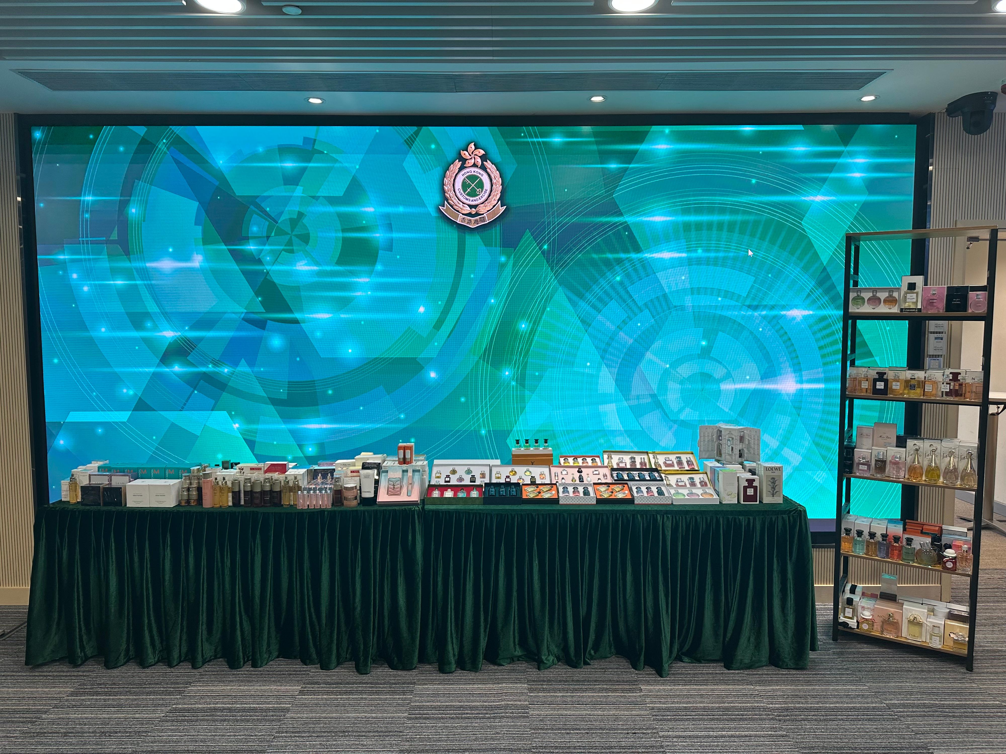 Hong Kong Customs mounted a special enforcement operation on May 28 and yesterday (June 5), and detected two cases of selling suspected counterfeit goods on online platforms. A total of about 700 items of suspected counterfeit goods, including perfumes and skincare products were seized, with an estimated market value of about $300,000. Photo shows some of the suspected counterfeit products seized.
