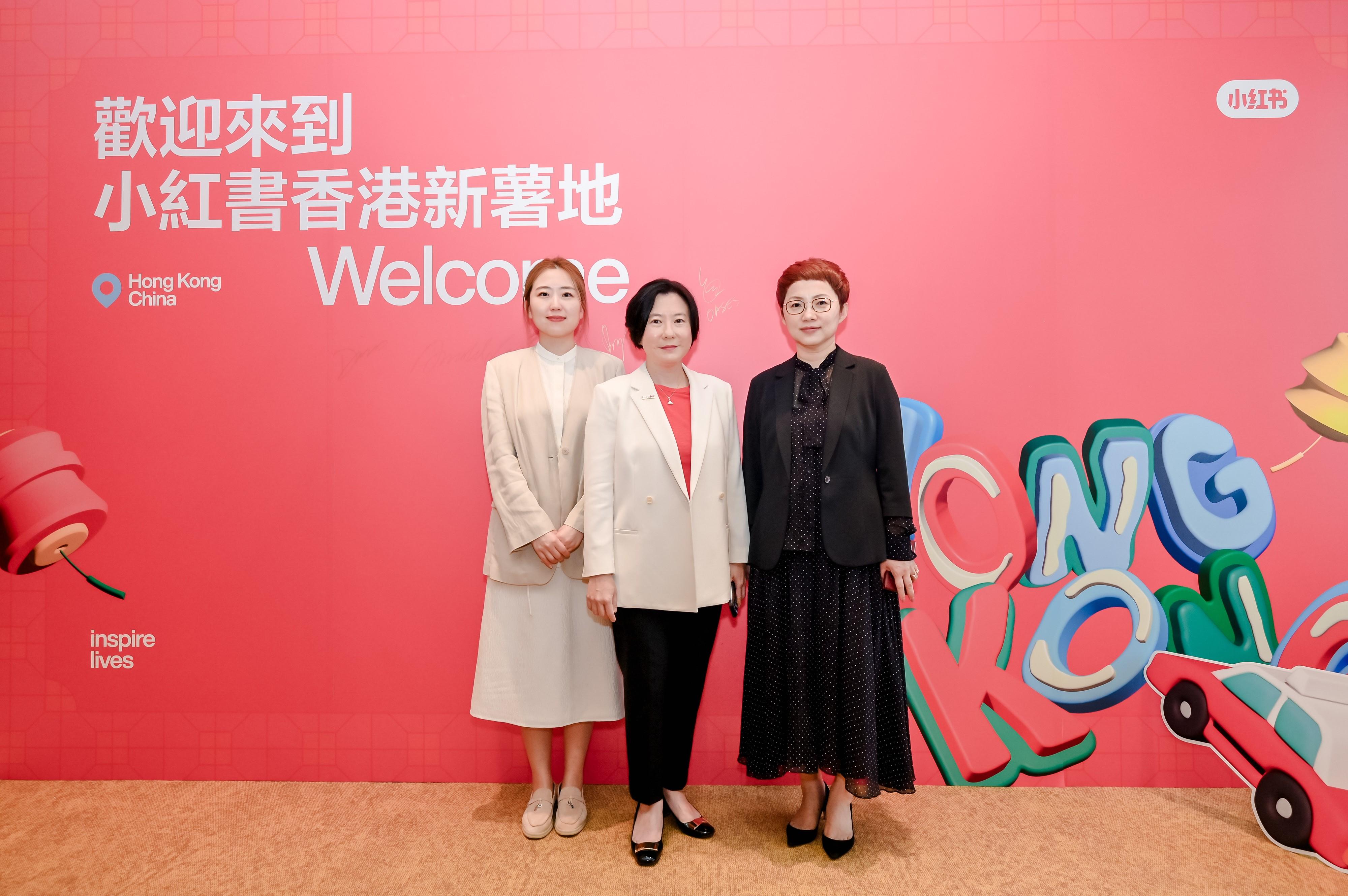 Invest Hong Kong (InvestHK) welcomes Xiaohongshu's first office outside the Mainland in Hong Kong. Photo shows the Director-General of Investment Promotion at InvestHK, Ms Alpha Lau (centre); the Chief Marketing Officer of Xiaohongshu, Ms Zhiheng (right); and the General Manager of Global Business Solutions at Xiaohongshu, Ms Qianyue (left), at Xiaohongshu's Hong Kong office opening ceremony today (June 7). 