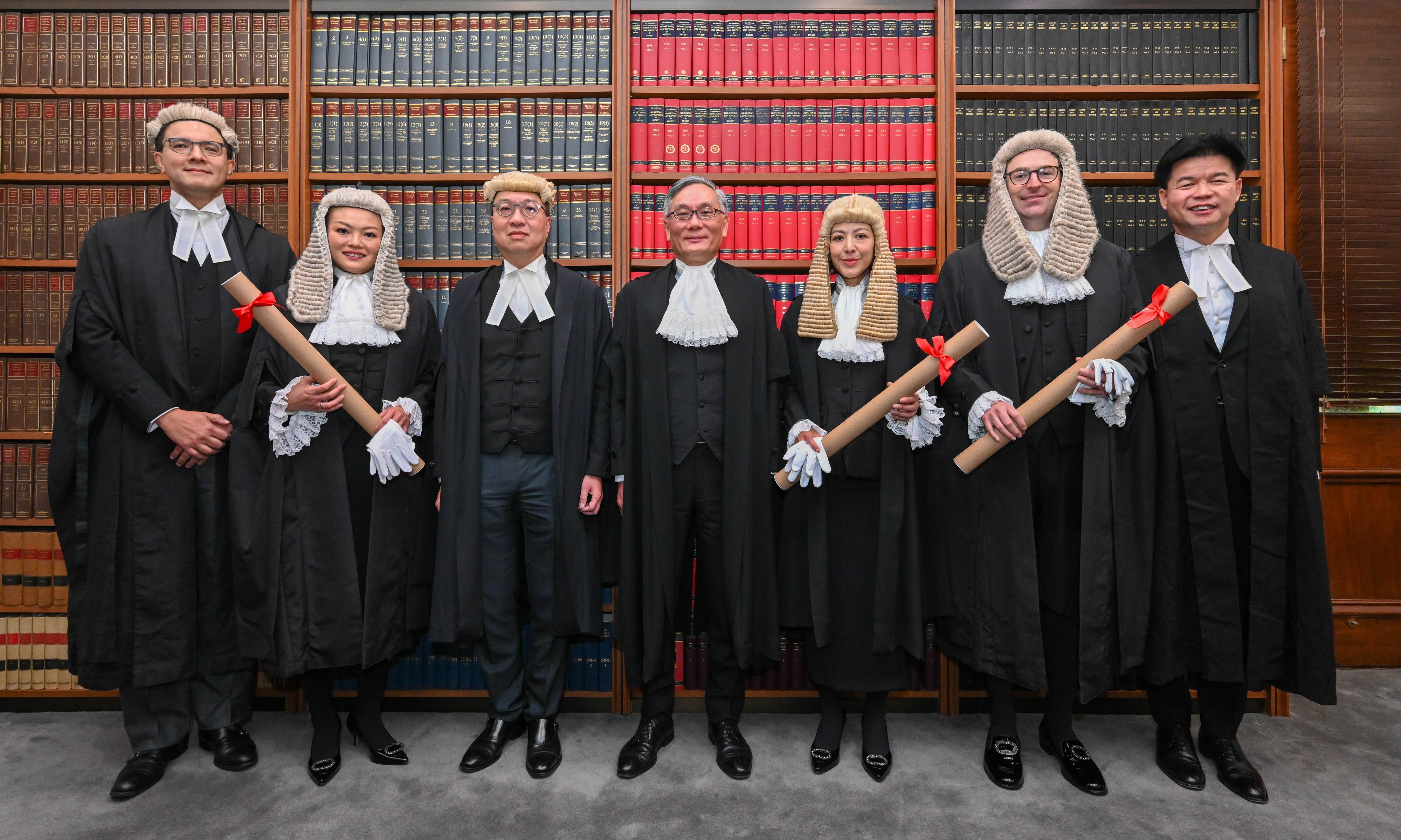 The ceremonial proceedings for the admission of the newly appointed Senior Counsel took place at the Court of Final Appeal today (June 7). Photo shows Chief Justice Andrew Cheung, Chief Justice of the Court of Final Appeal (centre); the Secretary for Justice, Mr Paul Lam, SC (third left); the Chairman of the Hong Kong Bar Association, Mr José-Antonio Maurellet, SC (first left); and the President of the Law Society of Hong Kong, Mr Roden Tong (first right), with the newly appointed Senior Counsel Ms Catrina Lam (third right), Ms Priscilia Lam (second left) and Mr Timothy Parker (second right).