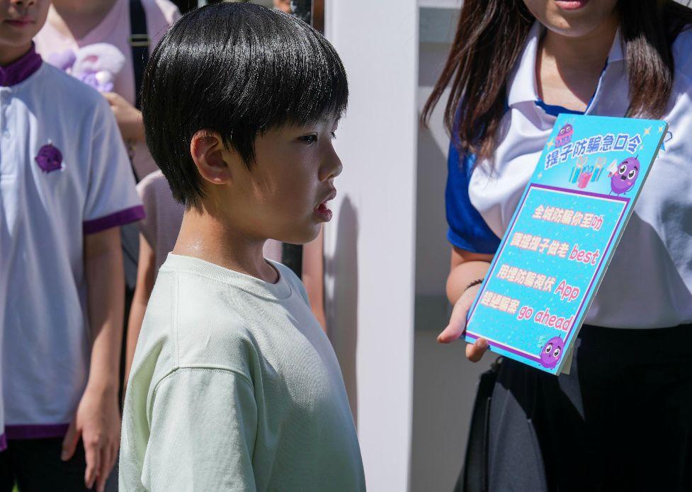 The Hong Kong Police Force organises the "The Little Grape’s 5th Anti-Scam Birthday Party" at the Harcourt Garden in Admiralty today (June 8). Photos shows members of the public participating in the “The Little Grape Anti-Scam Tongue Twister Contest” to reinforce scam prevention awareness.