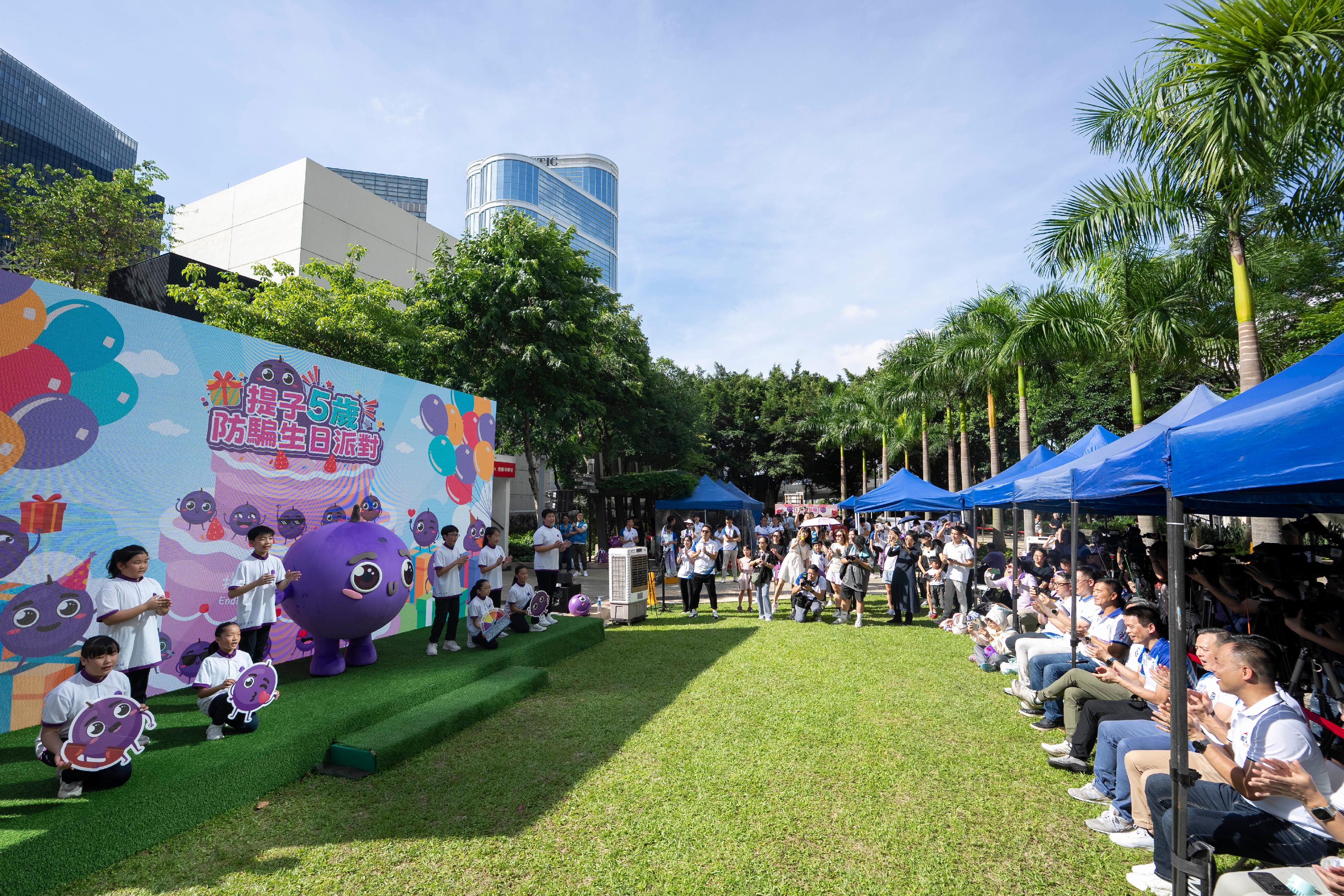 The Hong Kong Police Force organises the "The Little Grape’s 5th Anti-Scam Birthday Party" at the Harcourt Garden in Admiralty today (June 8). Photos shows students taking to the stage to perform a song promoting anti-scam messages.