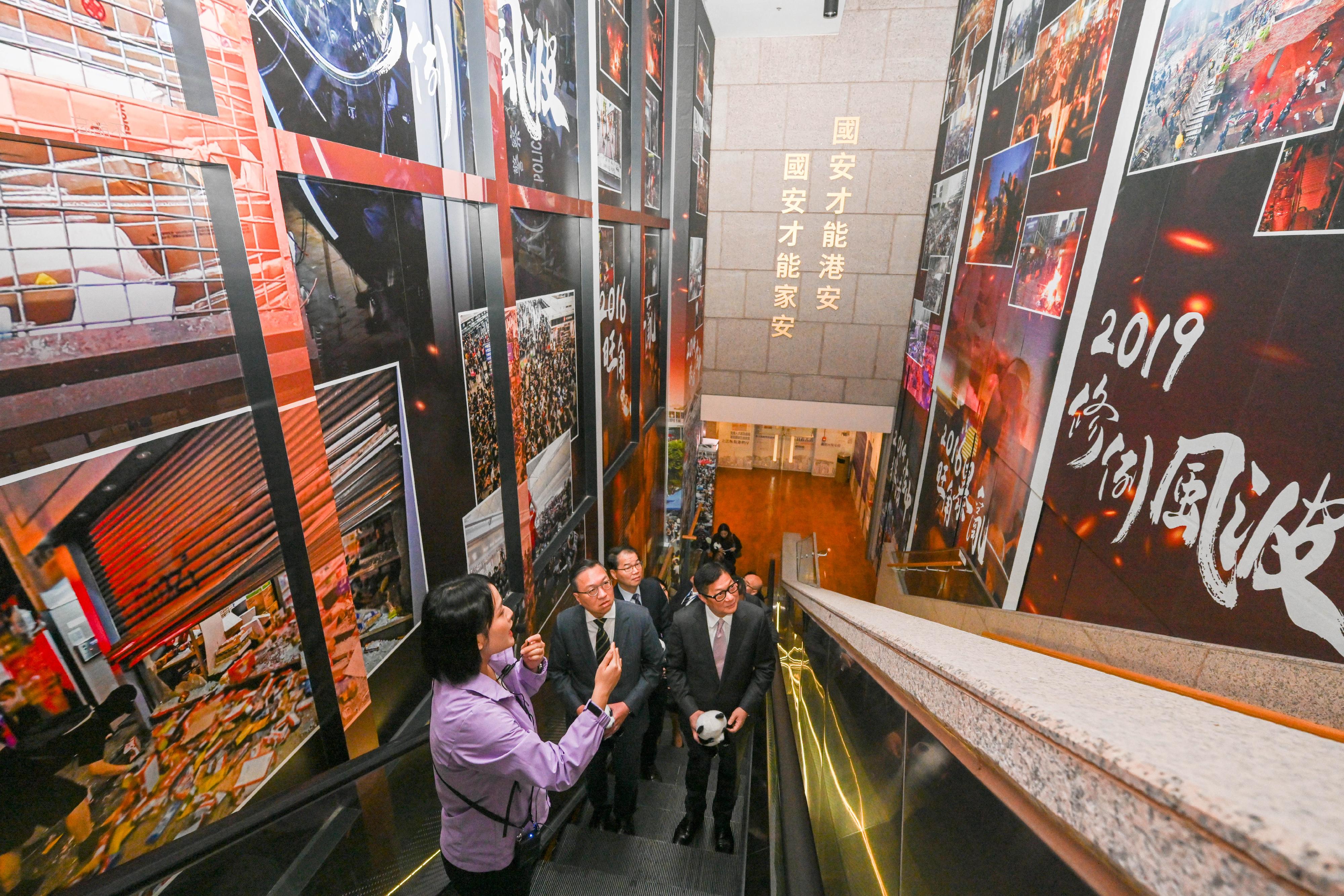 The Secretary for Justice, Mr Paul Lam, SC (second left), and the Secretary for Security, Mr Tang Ping-keung (first right), visit the 5th Anniversary of the Promulgation and Implementation of the Hong Kong National Security Law Thematic Exhibition.