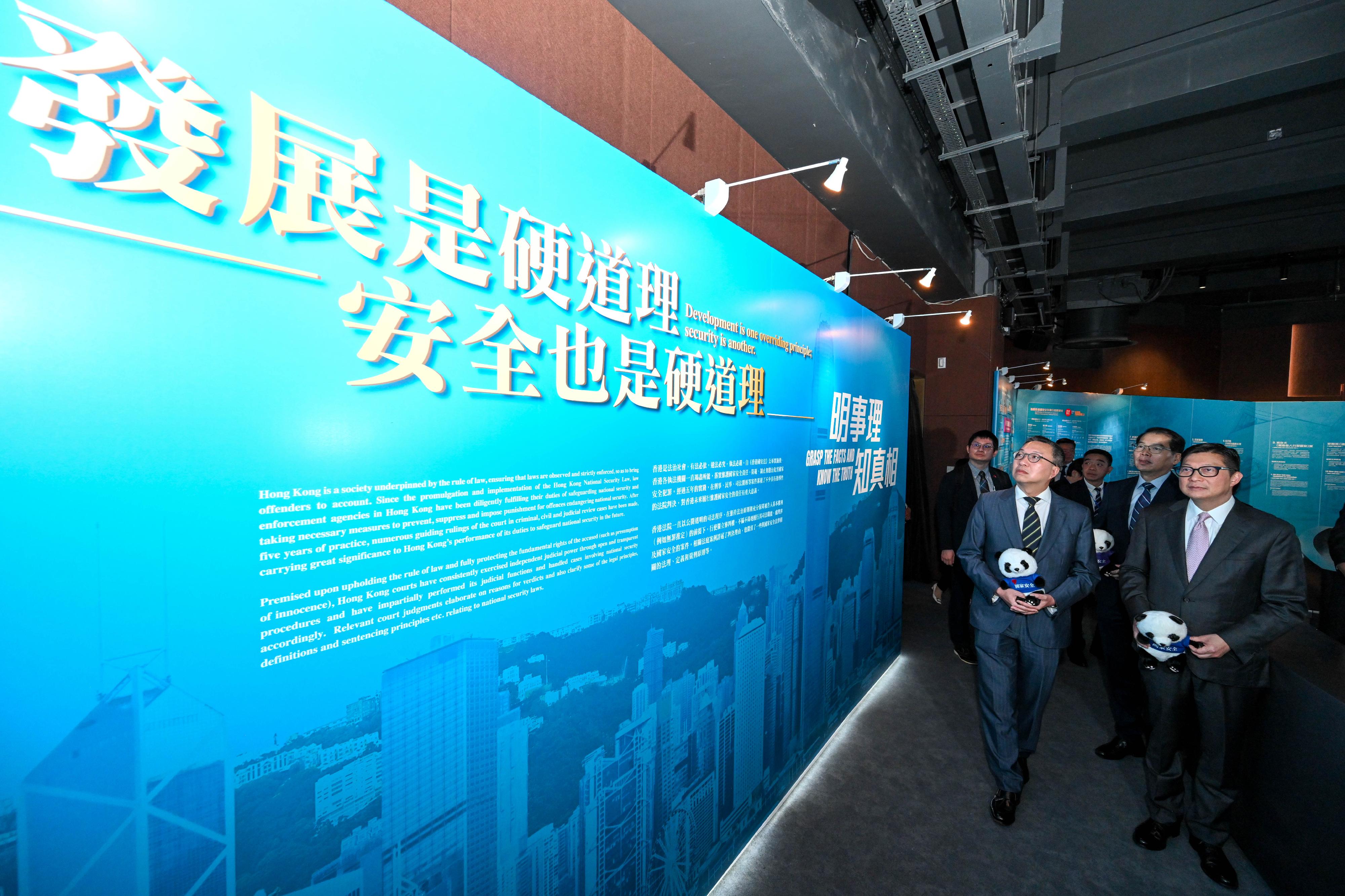 The Secretary for Justice, Mr Paul Lam, SC (left), and the Secretary for Security, Mr Tang Ping-keung (right), visit the 5th Anniversary of the Promulgation and Implementation of the Hong Kong National Security Law Thematic Exhibition.