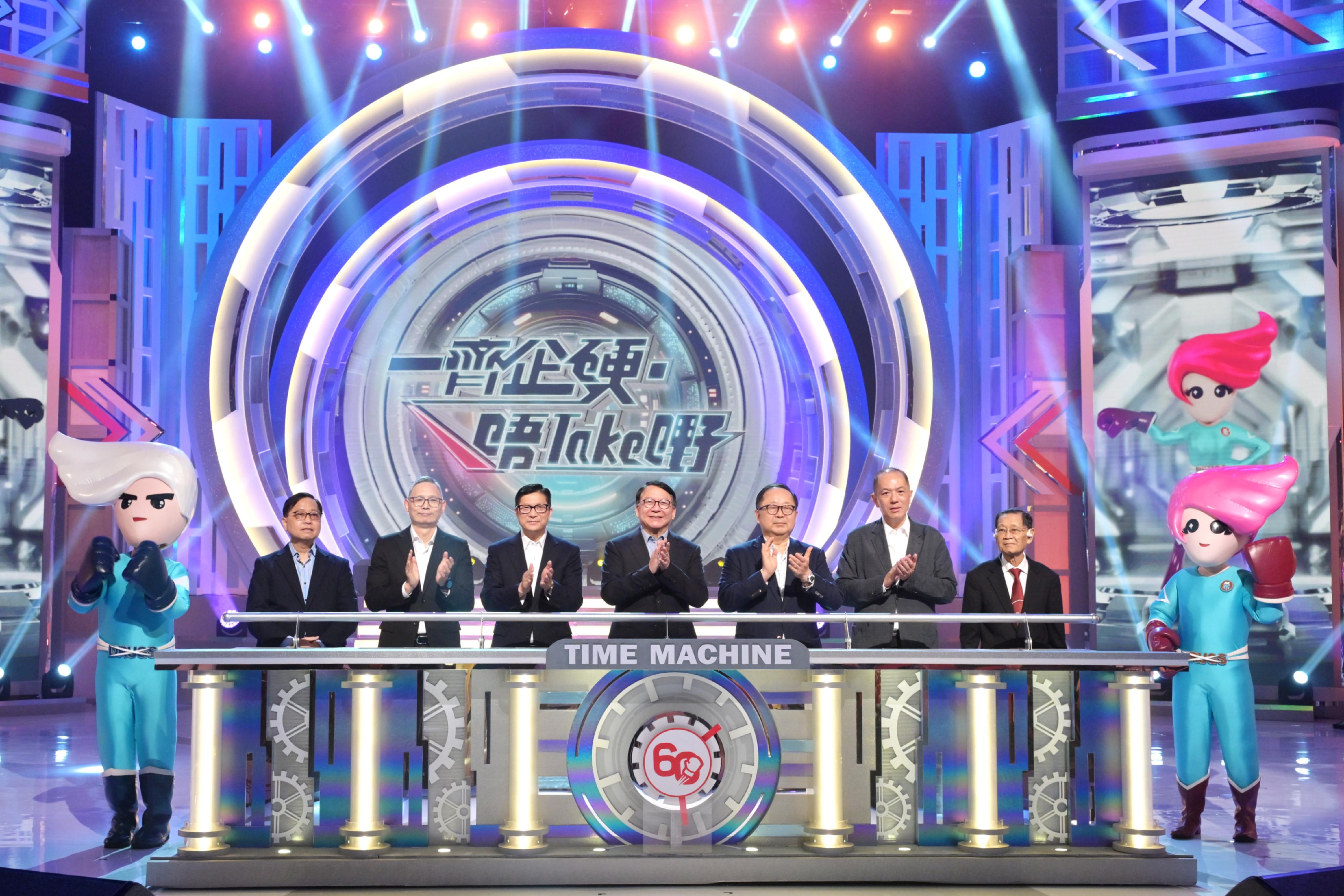 The large-scale anti-drug variety TV programme "Let's Stand Firm. Knock Drugs Out!" presented by the Action Committee Against Narcotics (ACAN) was held at TVB City in Tseung Kwan O this evening (June 13). Photo shows the Chief Secretary for Administration, Mr Chan Kwok-ki (centre); the Secretary for Security, Mr Tang Ping-keung (third left); the Chairman of ACAN, Dr Donald Li (third right); the Under Secretary for Security, Mr Michael Cheuk (second left); the Chairman of the ACAN Sub-committee on Preventive Education and Publicity, Mr Wilfred Ng (second right); the Chairman of the ACAN Sub-committee on Treatment and Rehabilitation, Professor Dennis Wong (first left); and the former Chairman of ACAN (1993), Professor Chen Char-nie (first right), officiating at the kick-off ceremony of the programme.