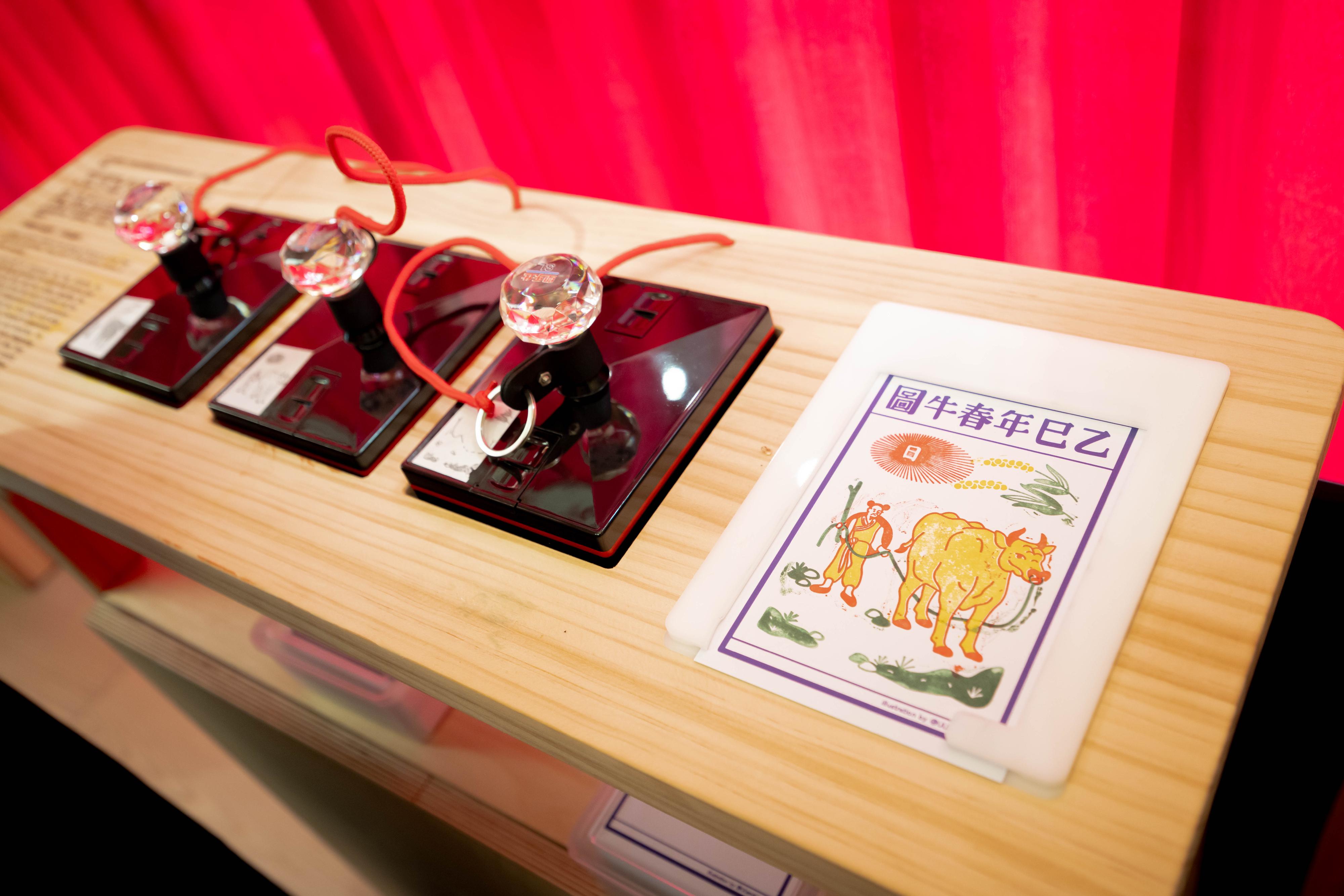 The Intangible Cultural Heritage (ICH) Office of the Leisure and Cultural Services Department presents the brand new ICH Mobile Centre "Mobile ICH", which will travel among districts and schools in Hong Kong starting from June to promote ICH items of Hong Kong. Photo shows the stamping counter for the Spring Ox Picture Souvenir Card.