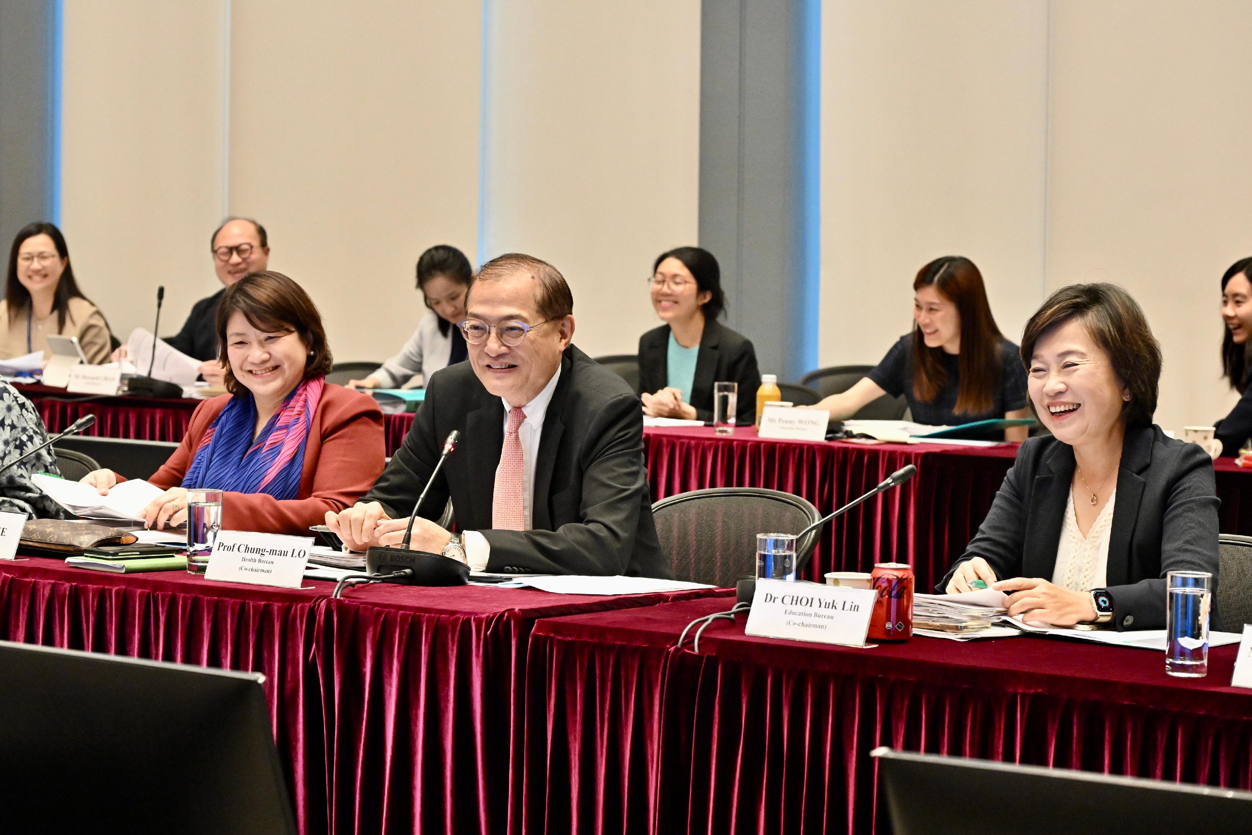 The Task Group on New Medical School, co-chaired by the Secretary for Health, Professor Lo Chung-mau (front row, centre), and the Secretary for Education, Dr Choi Yuk-lin (front row, right), meets separately with the three universities that have submitted proposals for the establishment of the third medical school for the second time today (June 17) to have a focused exchange on the specific implementation plans of their proposals. The Under Secretary for Health, Dr Libby Lee (first row, left), also attended the meeting.