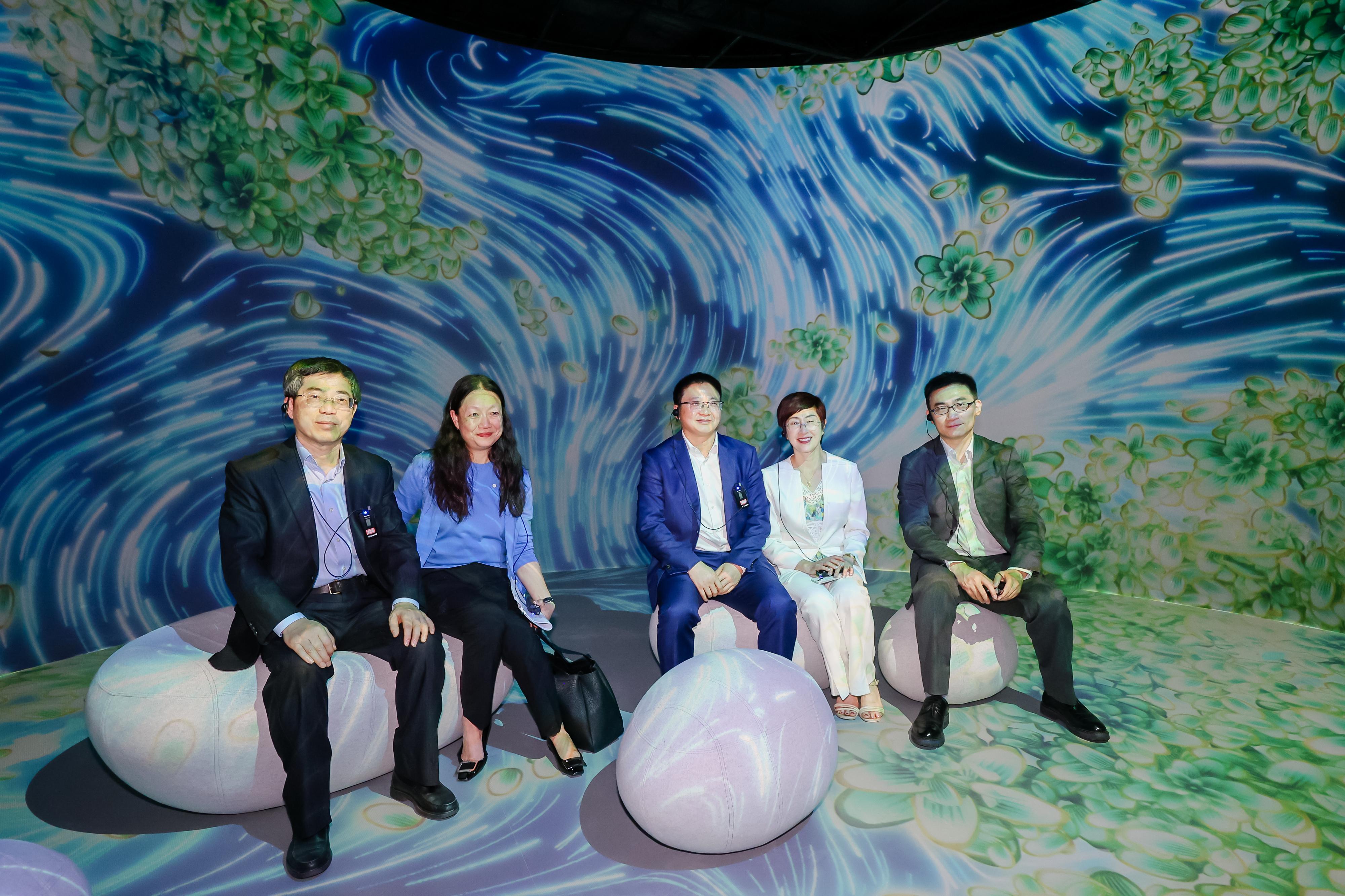 The "Immersive Hong Kong" roving exhibition, which showcases the charm and vibrancy of Hong Kong through interactive art technology, opened in Shanghai today (June 19). The exhibition invites visitors from Shanghai and the Yangtze River Delta to explore the unique opportunities and potential for tourism, education, business and investment in Hong Kong. Photo shows (from left) the Executive Deputy Director of the Administrative Office of the Committee for Liaison with Hong Kong, Macao, Taiwan and Overseas Chinese of the Chinese People's Political Consultative Conference Shanghai Committee, Mr Zhang Haoliang; the Director of Information Services, Mrs Apollonia Liu; Deputy Director of the Foreign Affairs Office of Shanghai Municipal People's Government Mr Xu Kai; the Director of the Hong Kong Economic and Trade Office in Shanghai, Mrs Laura Aron and the Director of Hong Kong, Macao and Taiwan Affairs Office of Shanghai Municipal Administration of Culture and Tourism, Mr Chen Kele, touring the exhibition.