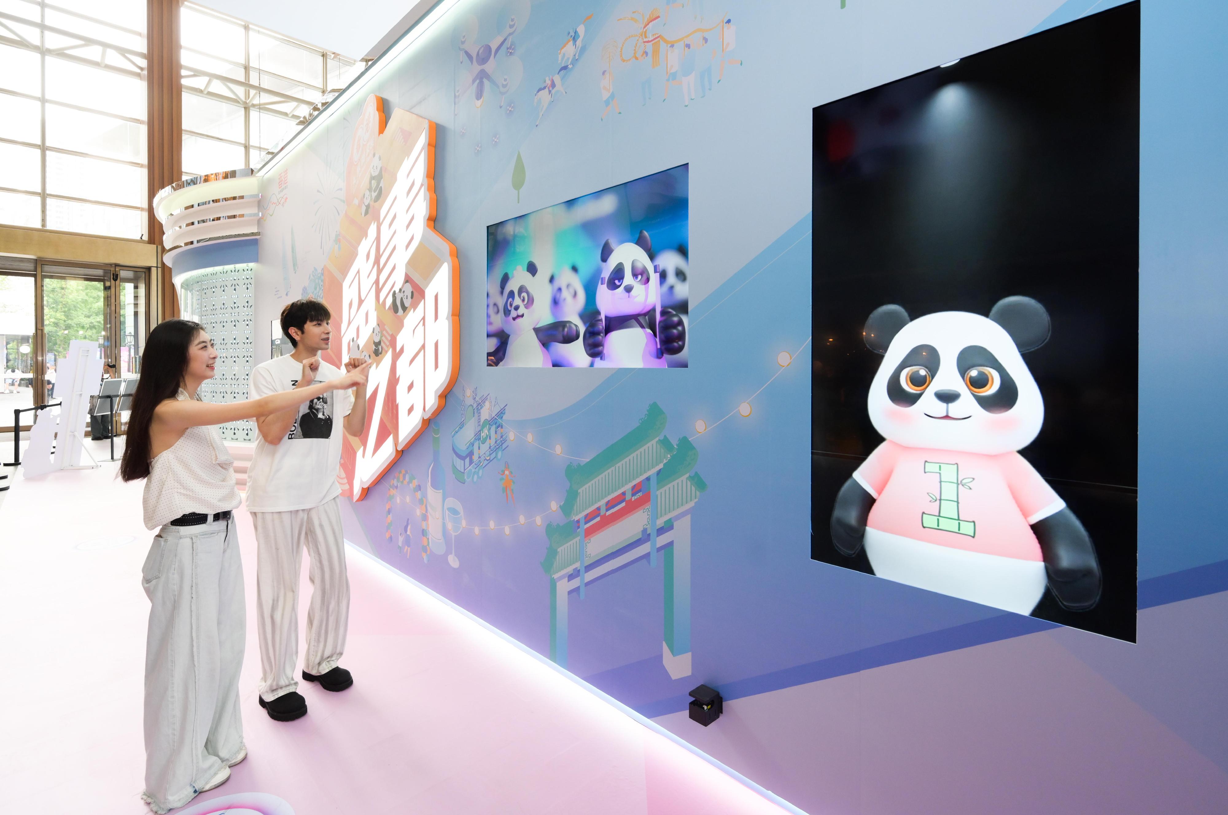 The "Immersive Hong Kong" roving exhibition, which showcases the charm and vibrancy of Hong Kong through interactive art technology, opened in Shanghai today (June 19). The exhibition invites visitors from Shanghai and the Yangtze River Delta to explore the unique opportunities and potential for tourism, education, business and investment in Hong Kong. Photo shows the installation with the theme of giant pandas and events capital at the exhibition.