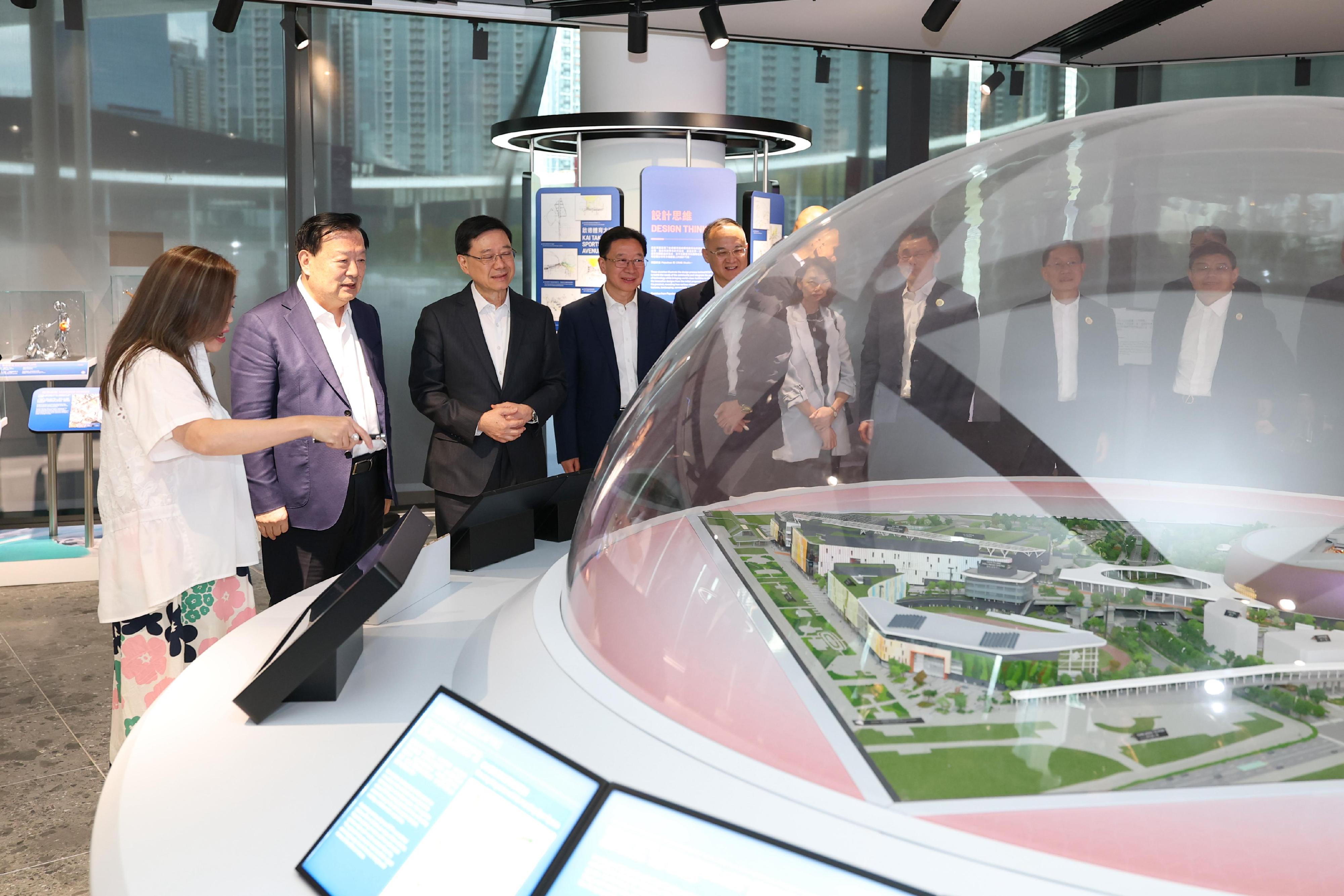 The Director of the Hong Kong and Macao Work Office of the Communist Party of China Central Committee and the Hong Kong and Macao Affairs Office of the State Council, Mr Xia Baolong, today (June 19), in Hong Kong, visited local cultural and tourism spots. Photo shows Mr Xia (second left) touring the Kai Tak Gallery of the Kai Tak Sports Park with the Chief Executive, Mr John Lee (third left); and the Secretary for Culture, Sports and Tourism, Miss Rosanna Law (first left).