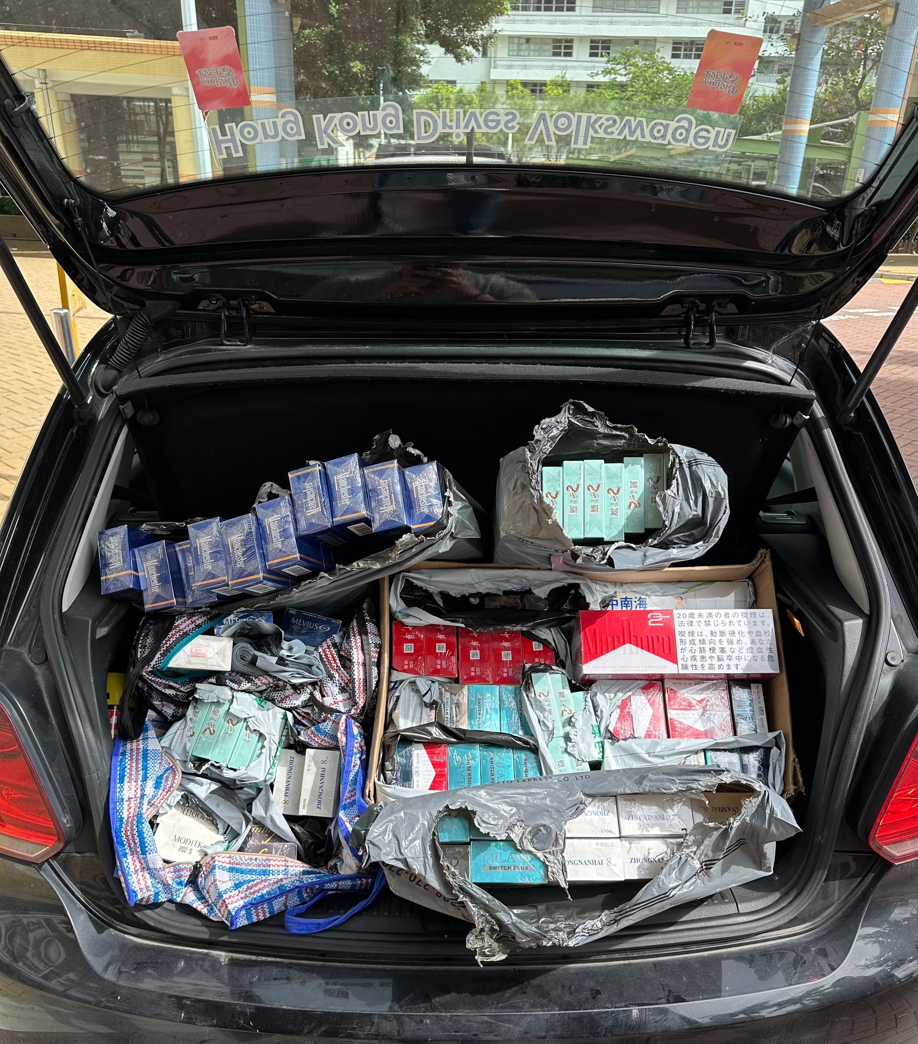 A 37-year-old man was sentenced to nine months' imprisonment at the Tuen Mun Magistrates' Courts today (June 20) for engaging in illicit cigarette distribution activities, in contravention of the Dutiable Commodities Ordinance. Photo shows some of the illicit cigarettes found in the boot of the man's private vehicle.