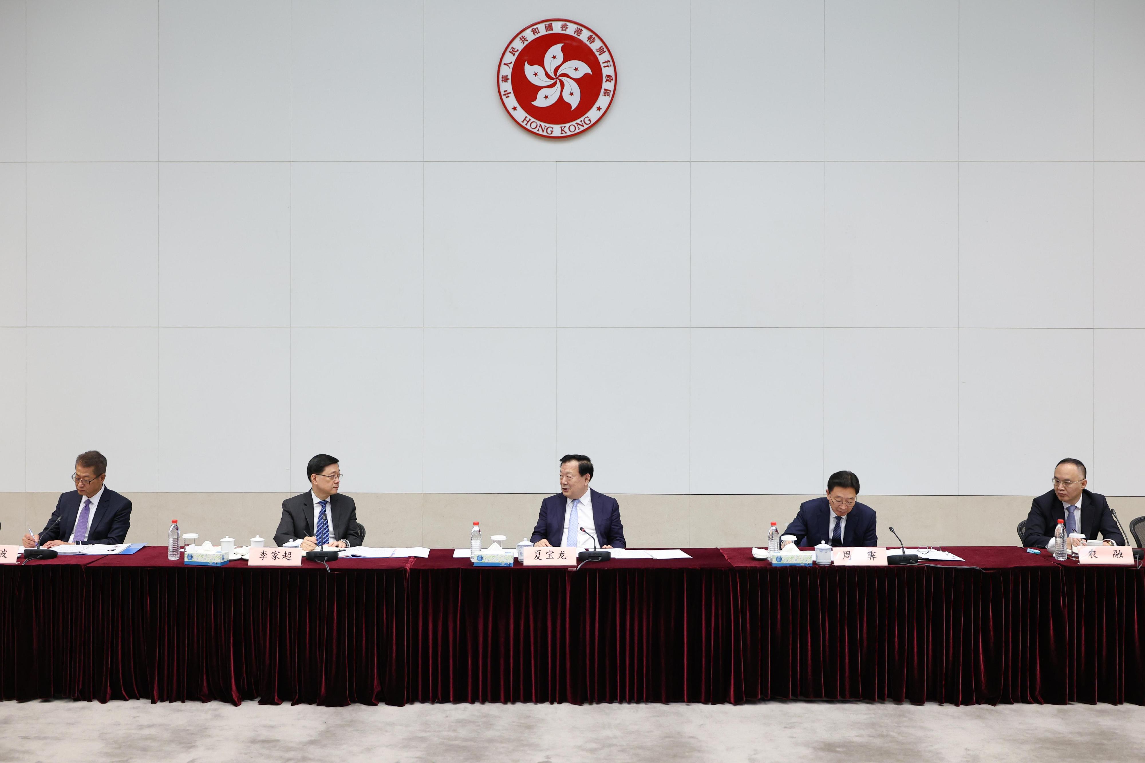 The Director of the Hong Kong and Macao Work Office of the Communist Party of China Central Committee and the Hong Kong and Macao Affairs Office of the State Council, Mr Xia Baolong (centre), today (June 20), attended an engagement session to interact with representatives of Hong Kong's commercial and financial sectors, including those from major chambers of commerce and enterprises. The session was also attended by the Chief Executive, Mr John Lee (second left) and the Financial Secretary, Mr Paul Chan (first left).