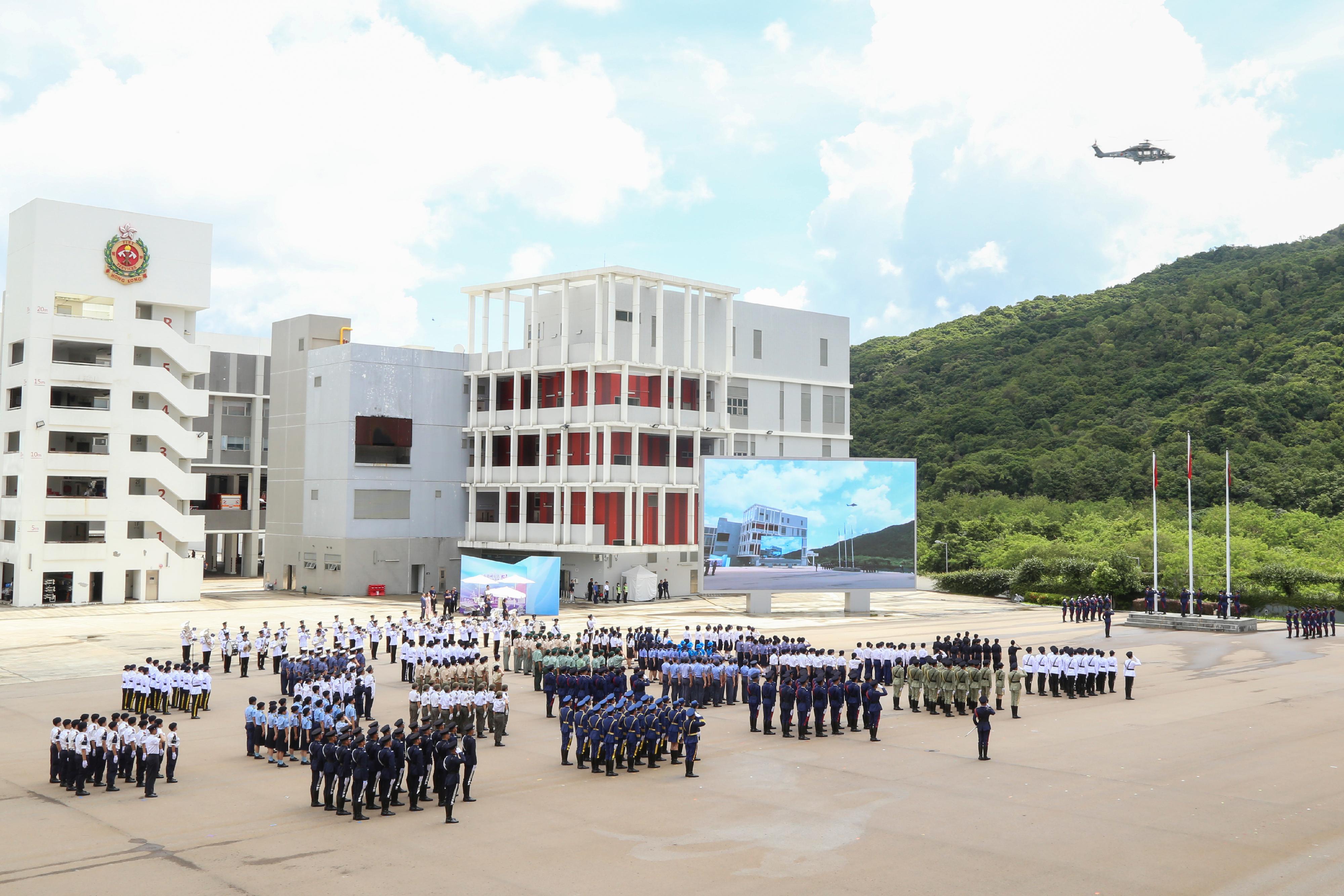 To mark the 5th anniversary of the promulgation and implementation of the Hong Kong National Security Law, the Security Bureau today (June 22) led disciplined services, youth groups of the disciplined services and auxiliary services and, for the first time, collaborated with youth uniformed groups subvented by the Home and Youth Affairs Bureau to hold a flag-raising ceremony at the Fire and Ambulance Services Academy.