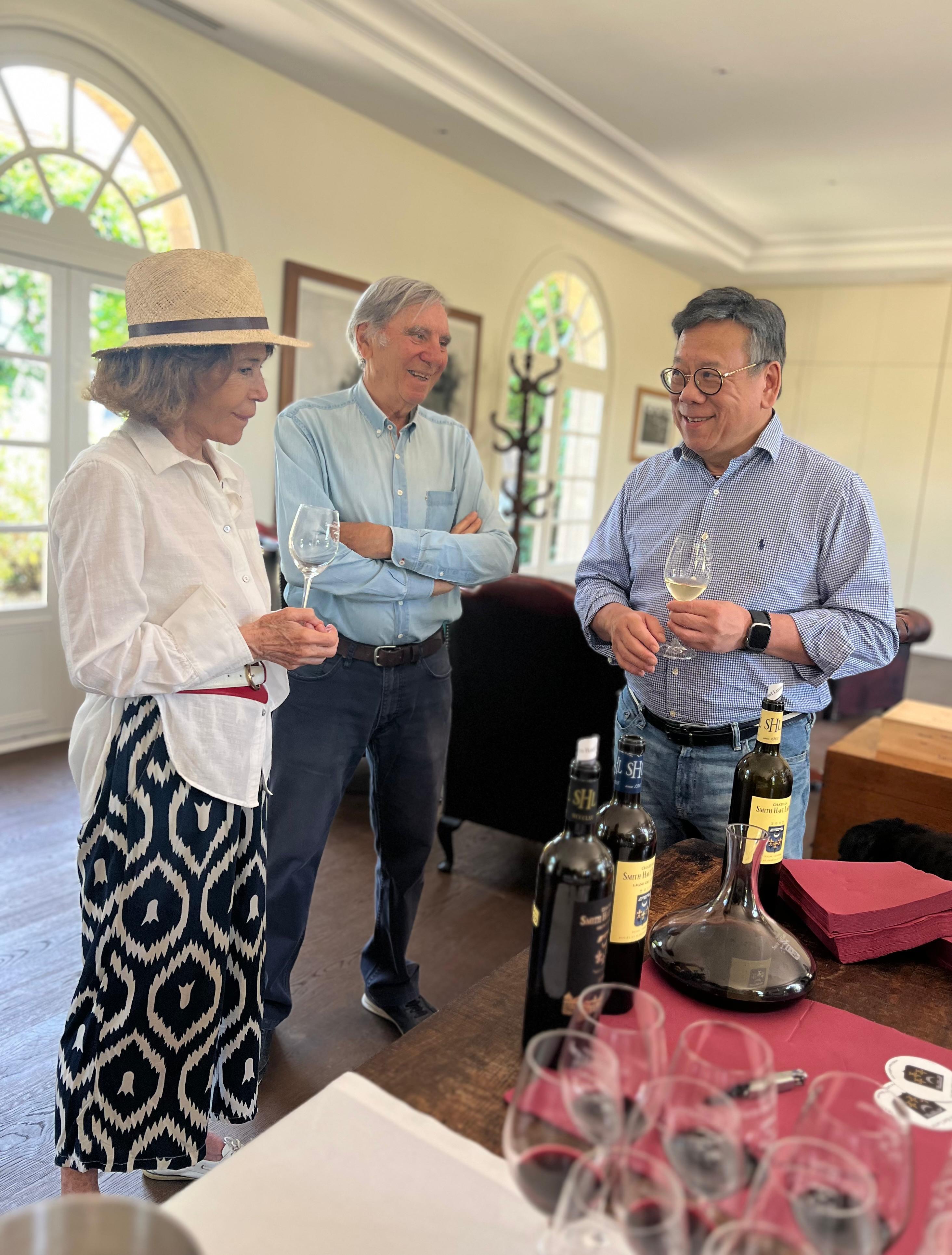 The Secretary for Commerce and Economic Development, Mr Algernon Yau, continued his visit to Bordeaux, France, to promote the advantages of Hong Kong as a wine and liquor trading hub to the local trade. Photo shows Mr Yau (right) visiting a vineyard in Bordeaux on June 21 (France time) to learn about its operations and promote Hong Kong's position as an international wine trading hub.