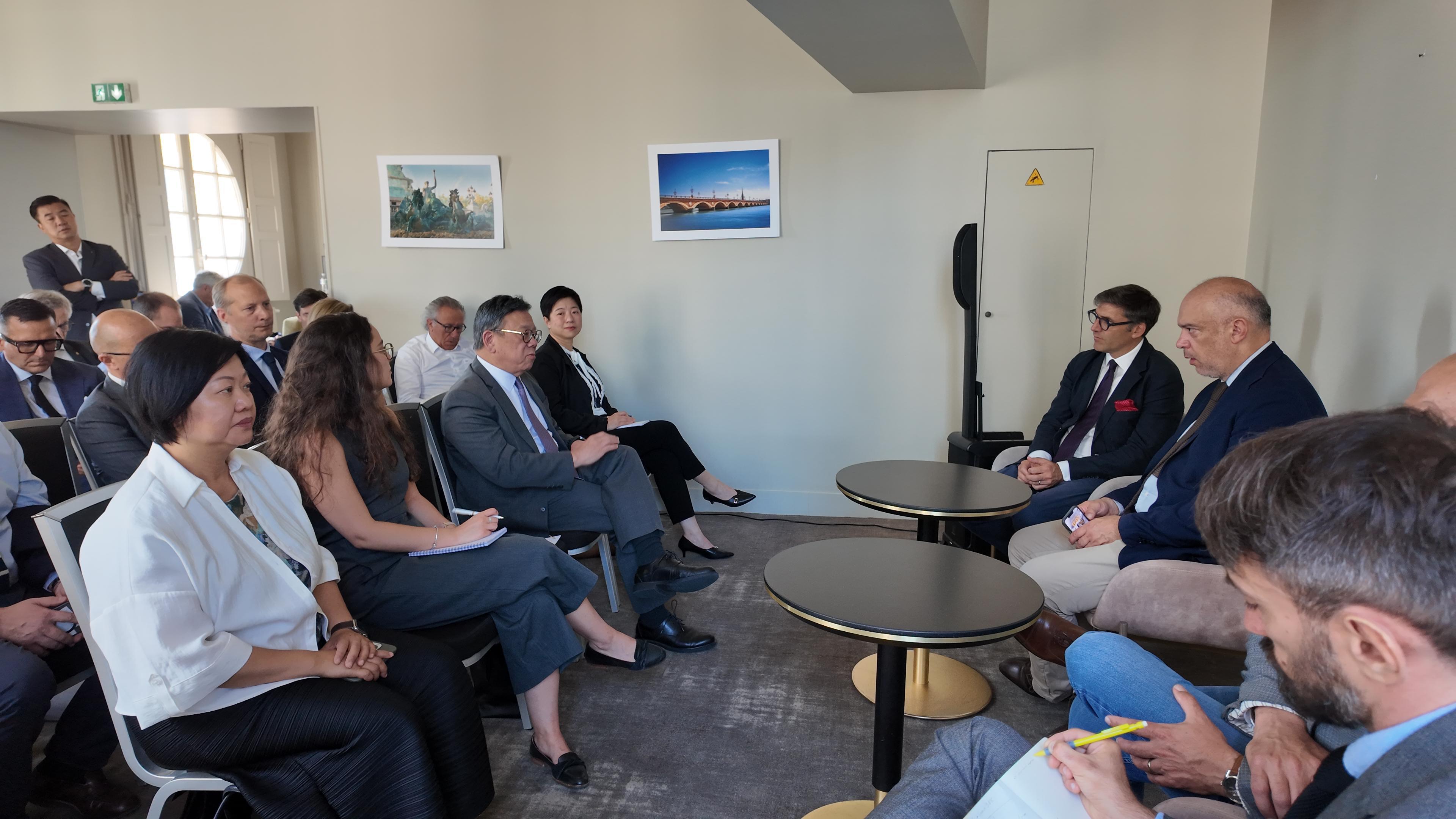 The Secretary for Commerce and Economic Development, Mr Algernon Yau, continued his visit to Bordeaux, France, to promote the advantages of Hong Kong as a wine and liquor trading hub to the local trade. Photo shows Mr Yau (third left) at a business roundtable with representatives of the trade of Bordeaux wine, Cognac and Armagnac on June 20 (France time) to exchange views on the latest developments of the trade and enhance co-operation on promoting wine and liquor trading. The Special Representative for Hong Kong Economic and Trade Affairs to the European Union, Ms Shirley Yung (first left), also attended.