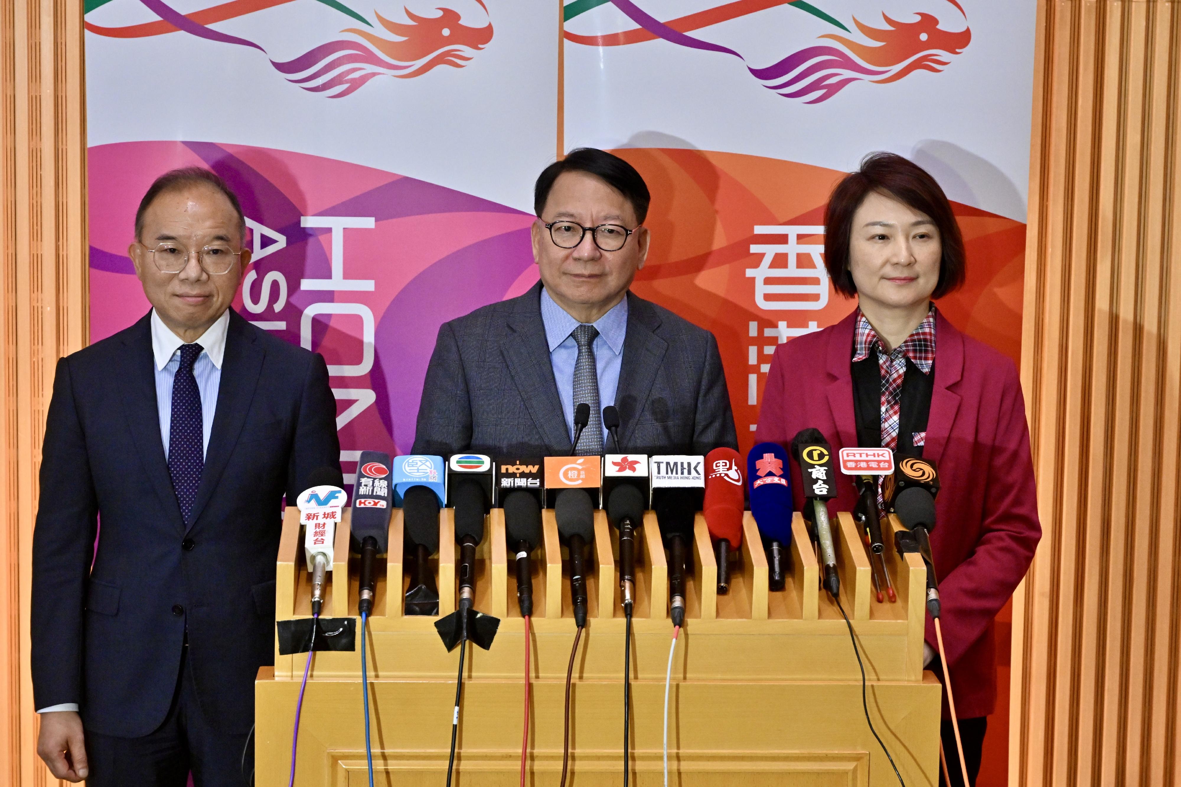The Chairman of the Constitution and Basic Law Promotion Steering Committee and Chief Secretary for Administration, Mr Chan Kwok-ki (centre), together with the Convenor of the Working Group on Patriotic Education, Dr Starry Lee (right); and the Secretary for Constitutional and Mainland Affairs, Mr Erick Tsang Kwok-wai (left), meets the media after the meeting of the Working Group on Patriotic Education under the Constitution and Basic Law Promotion Steering Committee today (June 23).