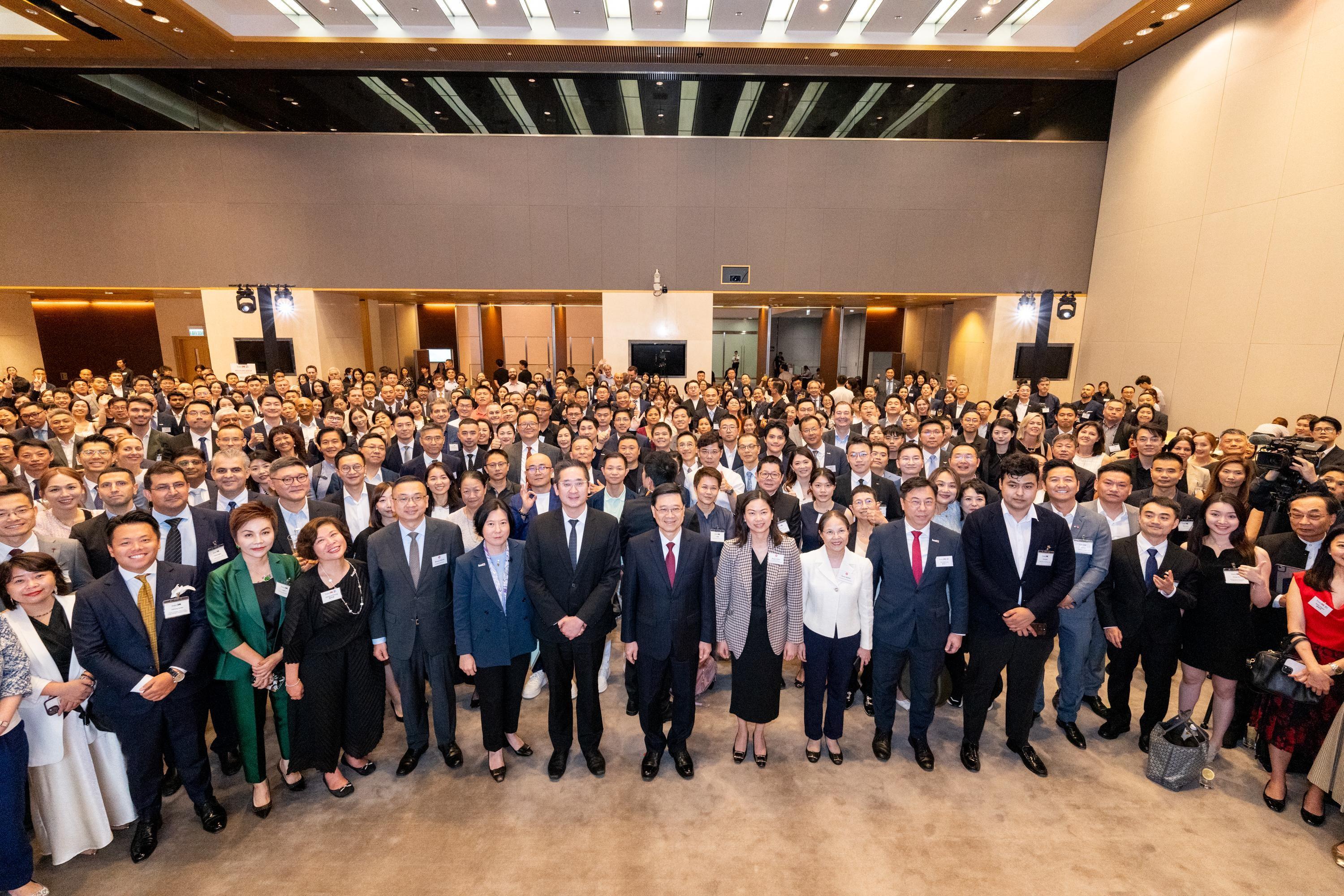 The Chief Executive, Mr John Lee (front row, eighth left); the Acting Secretary for Commerce and Economic Development, Dr Bernard Chan (front row, seventh left); the Permanent Secretary for Commerce and Economic Development, Ms Maggie Wong (front row, ninth left); and the Director-General of Investment Promotion, Ms Alpha Lau (front row, sixth left), are pictured with guests at an Invest Hong Kong reception today (June 24) for new establishments of international and Mainland businesses in Hong Kong.

