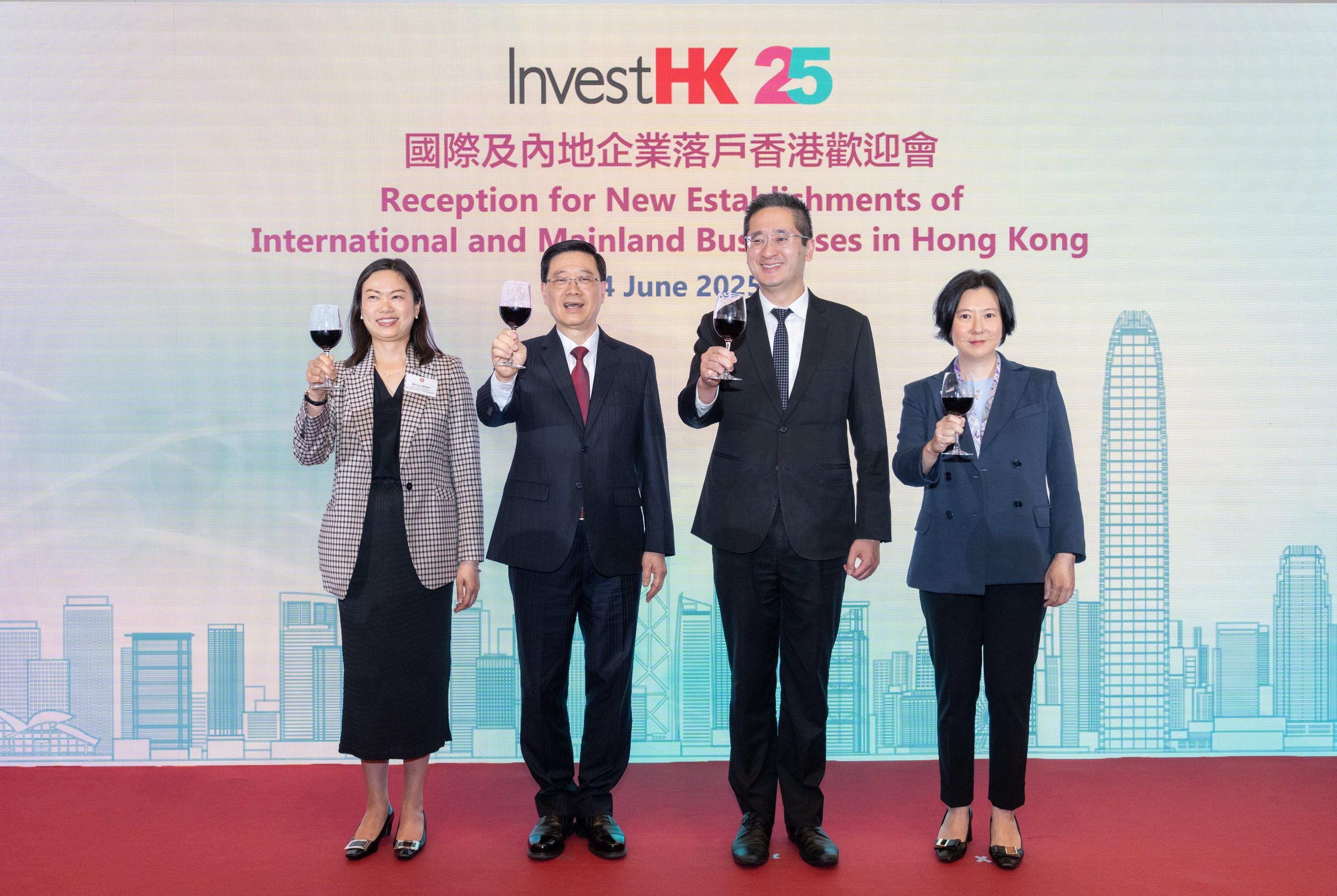 The Chief Executive, Mr John Lee (second left); the Acting Secretary for Commerce and Economic Development, Dr Bernard Chan (second right); the Permanent Secretary for Commerce and Economic Development, Ms Maggie Wong (first left); and the Director-General of Investment Promotion, Ms Alpha Lau (first right), give a toast at an Invest Hong Kong reception today (June 24) for new establishments of international and Mainland businesses in Hong Kong, thanking for their trust and support in Hong Kong's business environment and calling upon them to continue using the city's role as a "super connector" and "super value-adder" to expand globally.

