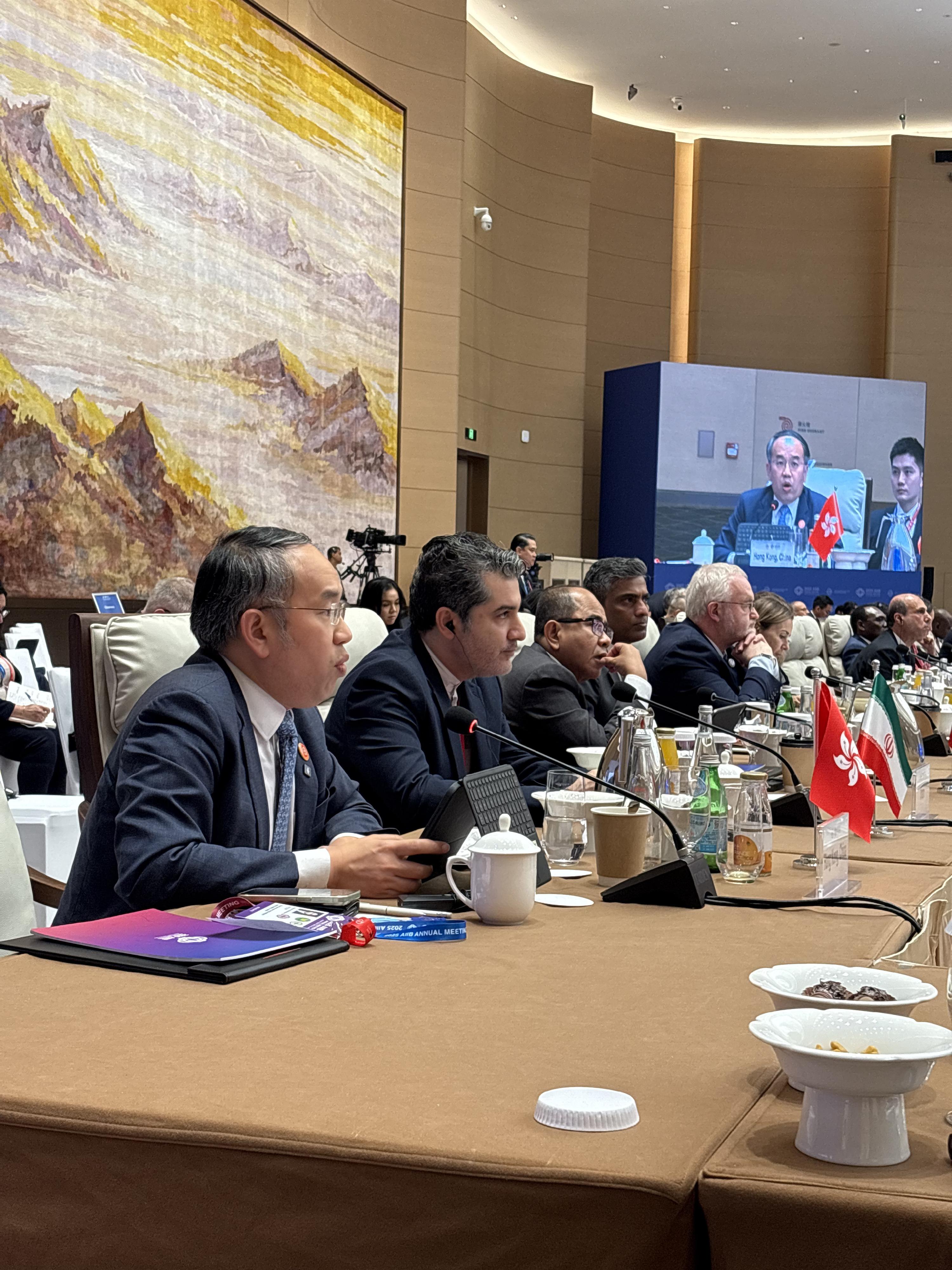 The Secretary for Financial Services and the Treasury, Mr Christopher Hui (first left), attended the 10th Annual Meeting of the Board of Governors of the Asian Infrastructure Investment Bank and spoke at the Governors' Business Roundtable on "Fostering Development and Infrastructure Connectivity" in Beijing today (June 25).