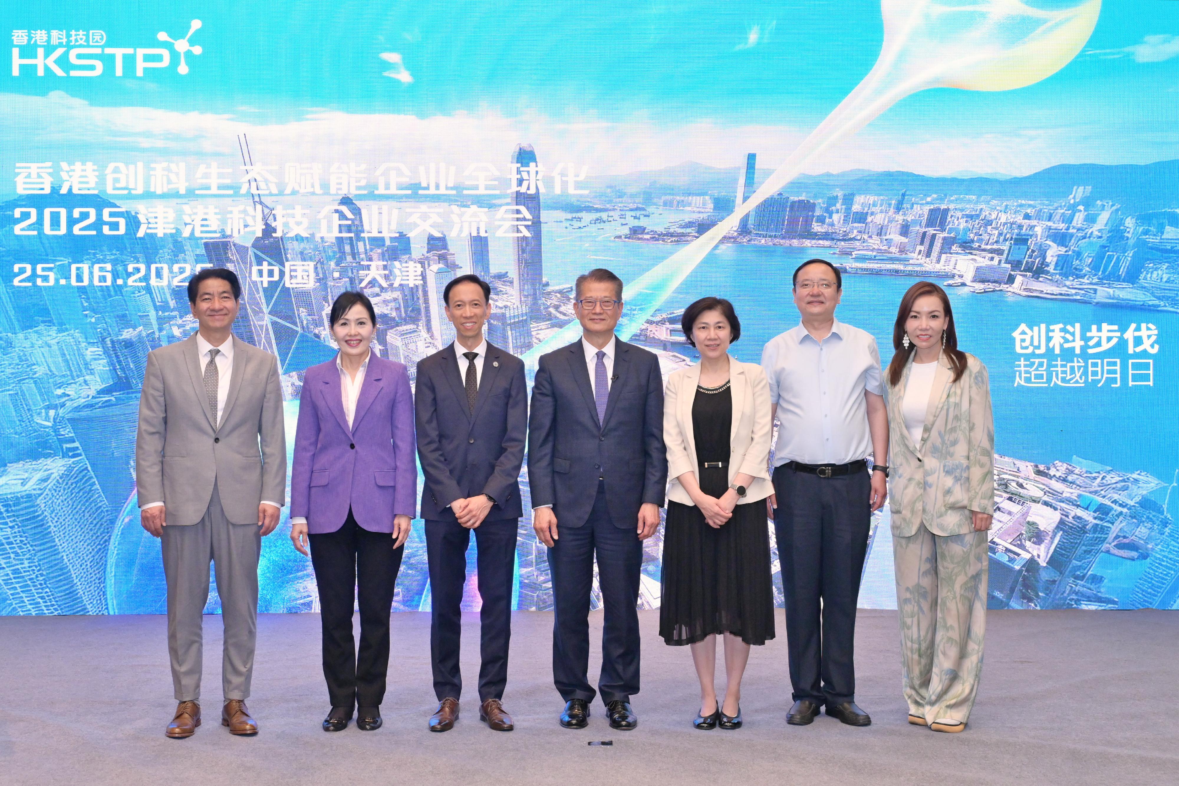 The Financial Secretary, Mr Paul Chan, continued his visit to Tianjin today (June 25) and attended the World Economic Forum Annual Meeting of the New Champions 2025 (also known as Summer Davos). Photo shows Mr Chan (centre) and other guests at an exchange session between technology enterprises from Tianjin and Hong Kong, organised by the Hong Kong Science and Technology Parks Corporation.  
