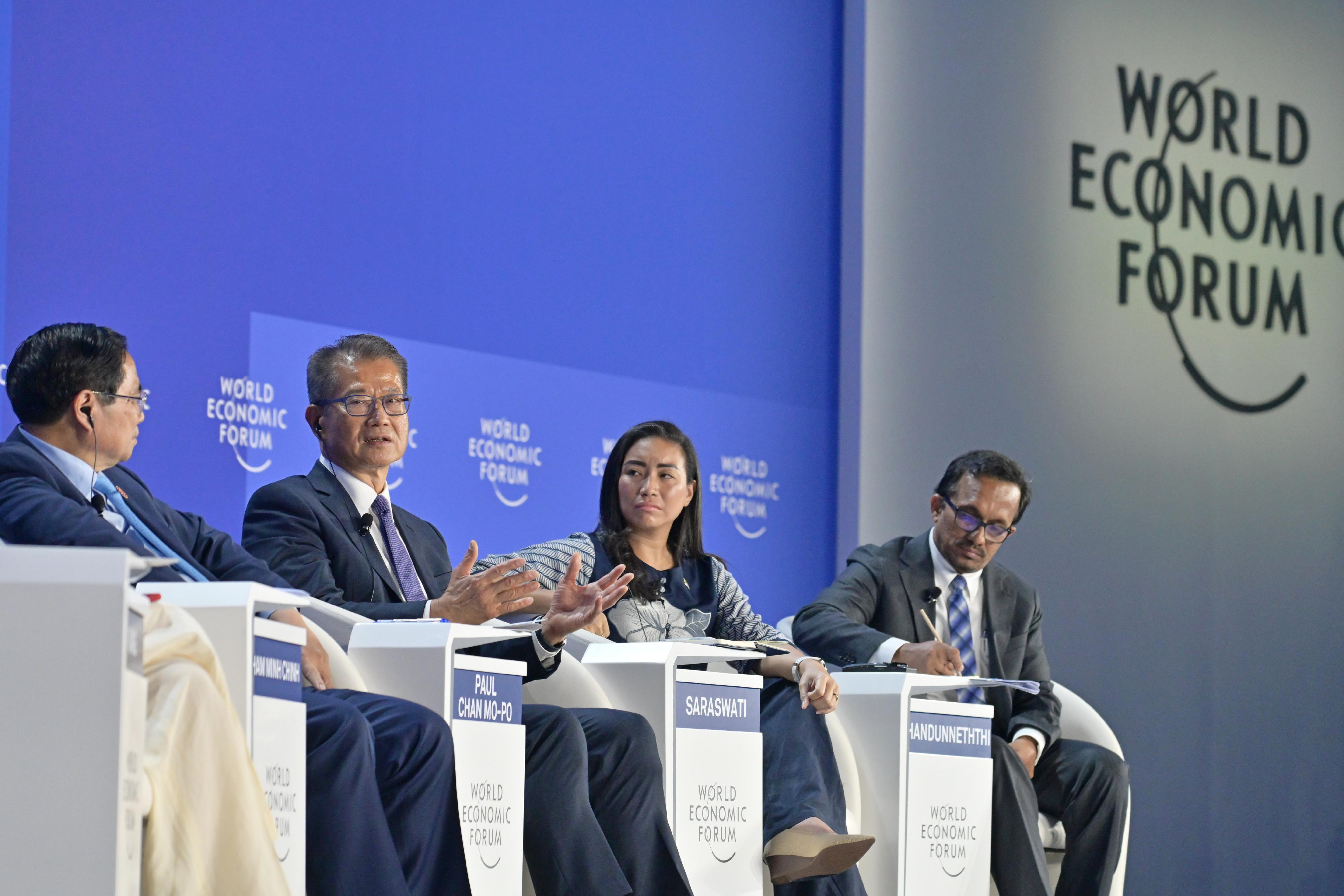 The Financial Secretary, Mr Paul Chan, continued his visit to Tianjin today (June 25) and attended the World Economic Forum Annual Meeting of the New Champions 2025 (also known as Summer Davos). Photo shows Mr Chan (second left) speaking at a discussion session titled "Is Asia's Century at Risk?" 