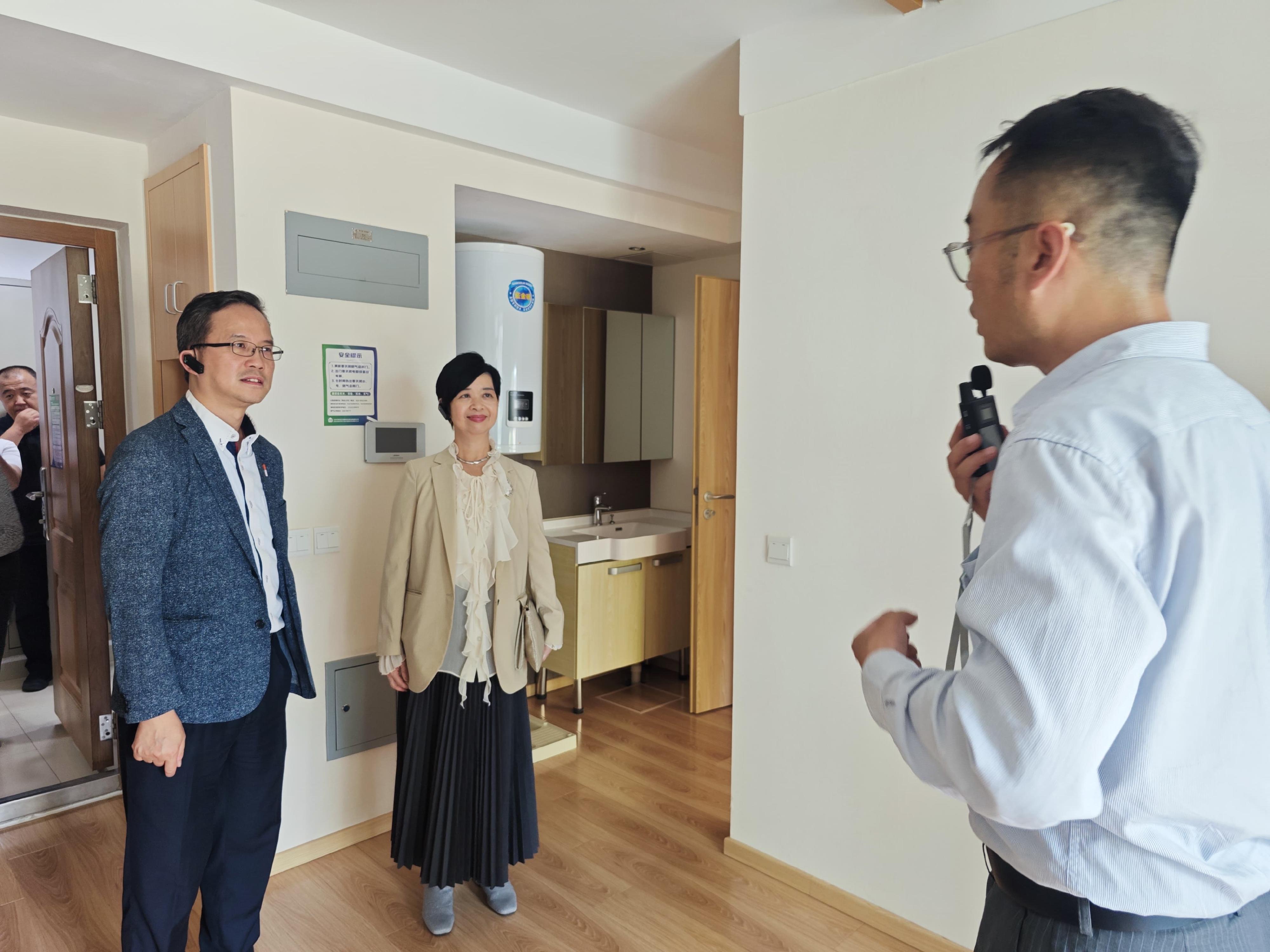 The Secretary for Housing, Ms Winnie Ho (centre), visits the Qingtangwan public rental housing project in Beijing today (June 26).