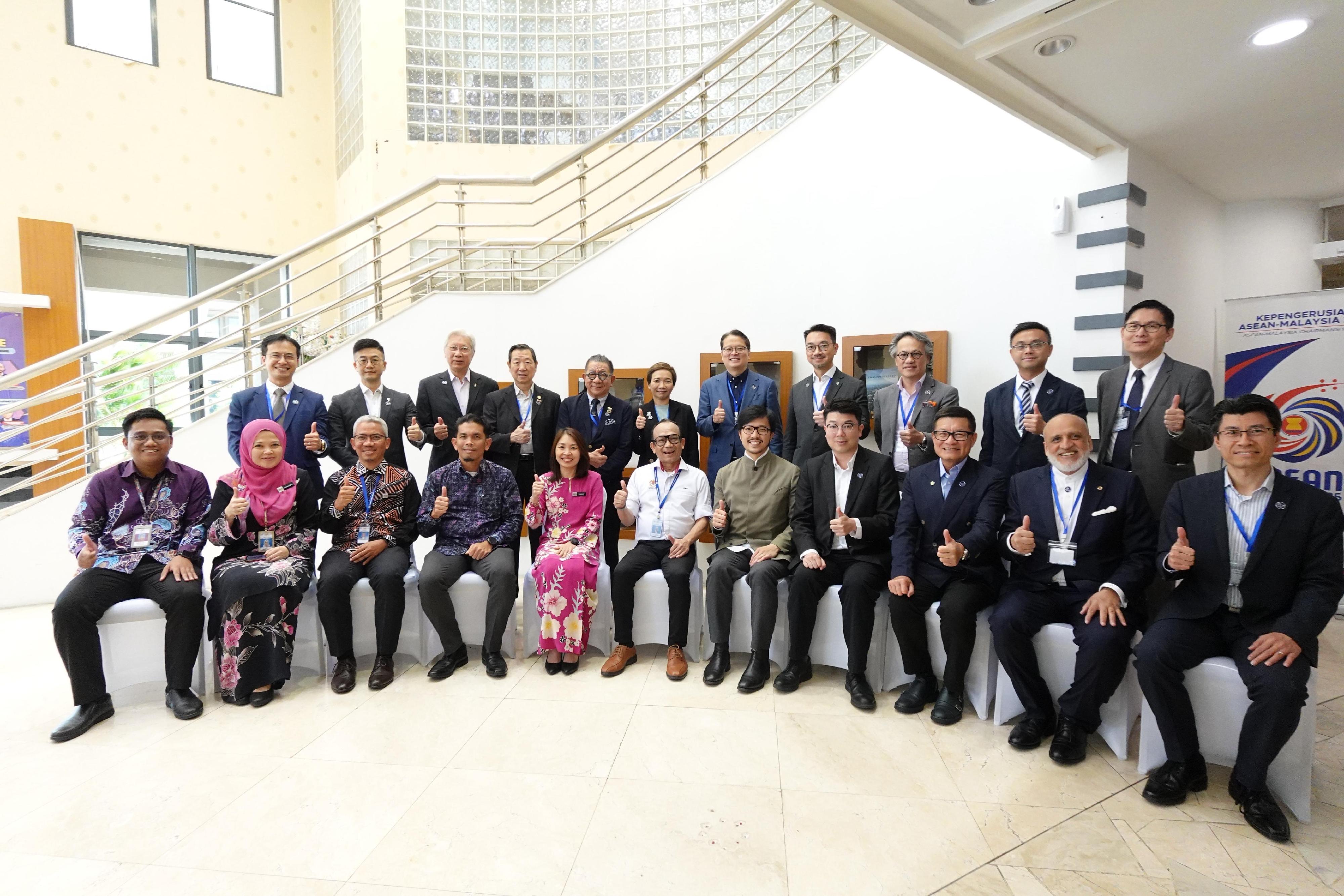 The Commissioner for Belt and Road, Mr Nicholas Ho, led a delegation to visit Indonesia and Malaysia from June 22 to 26. Photo shows Mr Ho (front row, fifth right) and members of the delegation in a meeting with representatives of the Public Private Partnership Unit of the Prime Minister's Department in Malaysia in Kuala Lumpur on June 26.

