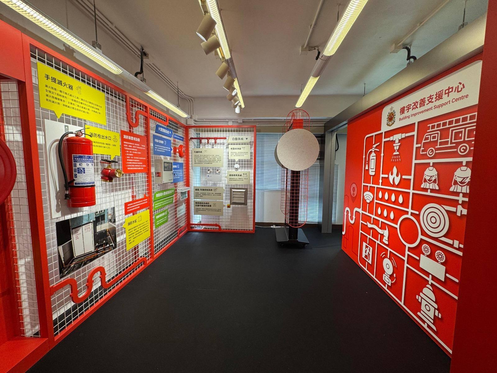 The Fire Services Department (FSD) announced today (June 26) that new FSD Building Improvement Support Centres (BISCs) have been established in Wan Chai and Yuen Long respectively to provide more convenient one-stop support services for owners and occupiers of old buildings on Hong Kong Island and in the New Territories. Photo shows the exhibition area in the BISC in Yuen Long displaying various fire service installations and equipment, enabling the public to gain a deeper understanding of the related information.