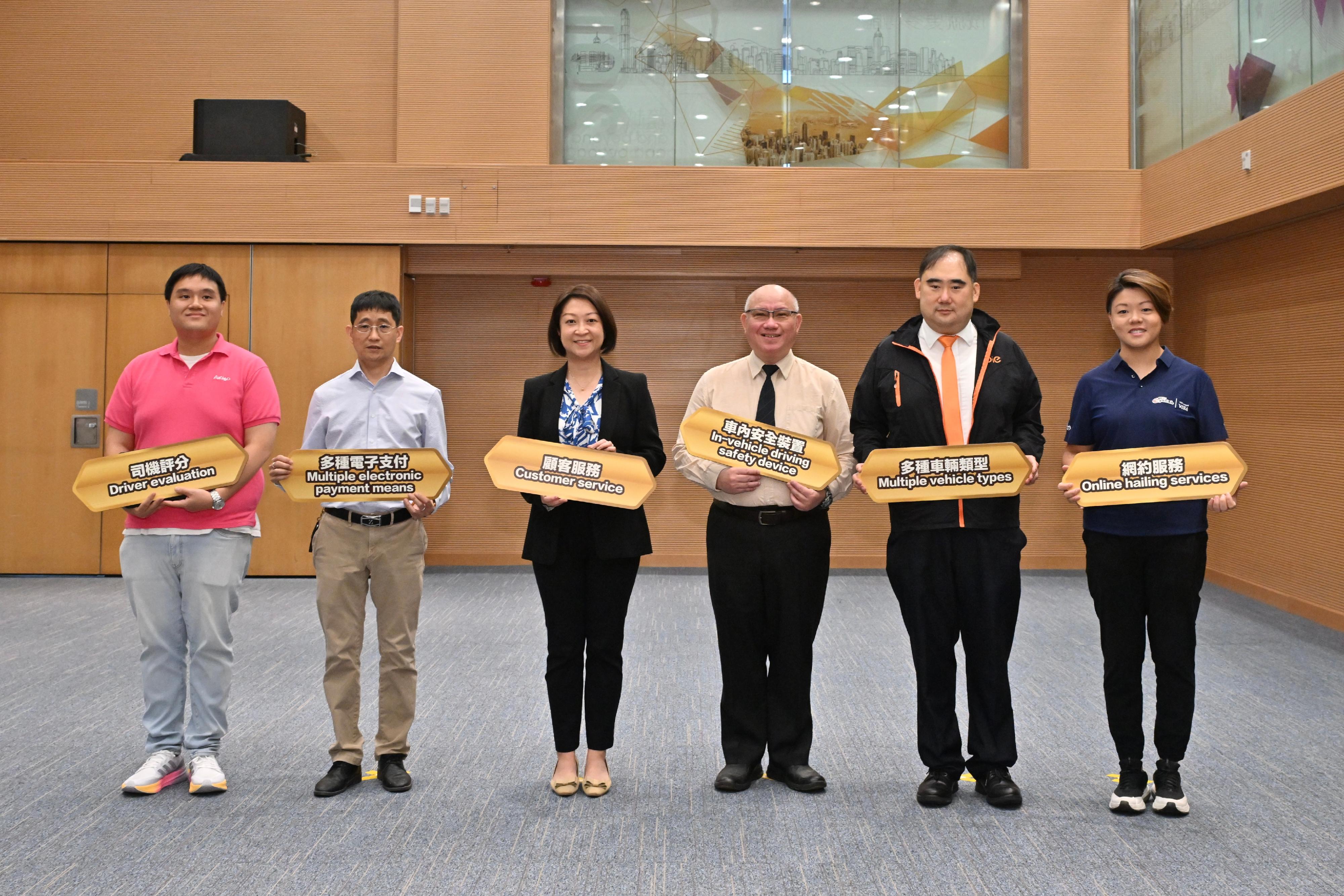 The Transport Department said today (June 27) that official Taxi Fleet Licences are scheduled to be issued to the five taxi fleets in July to offer quality taxi services to the public. Photo shows the Commissioner for Transport, Ms Angela Lee (third left), and representatives of taxi fleet operators.
