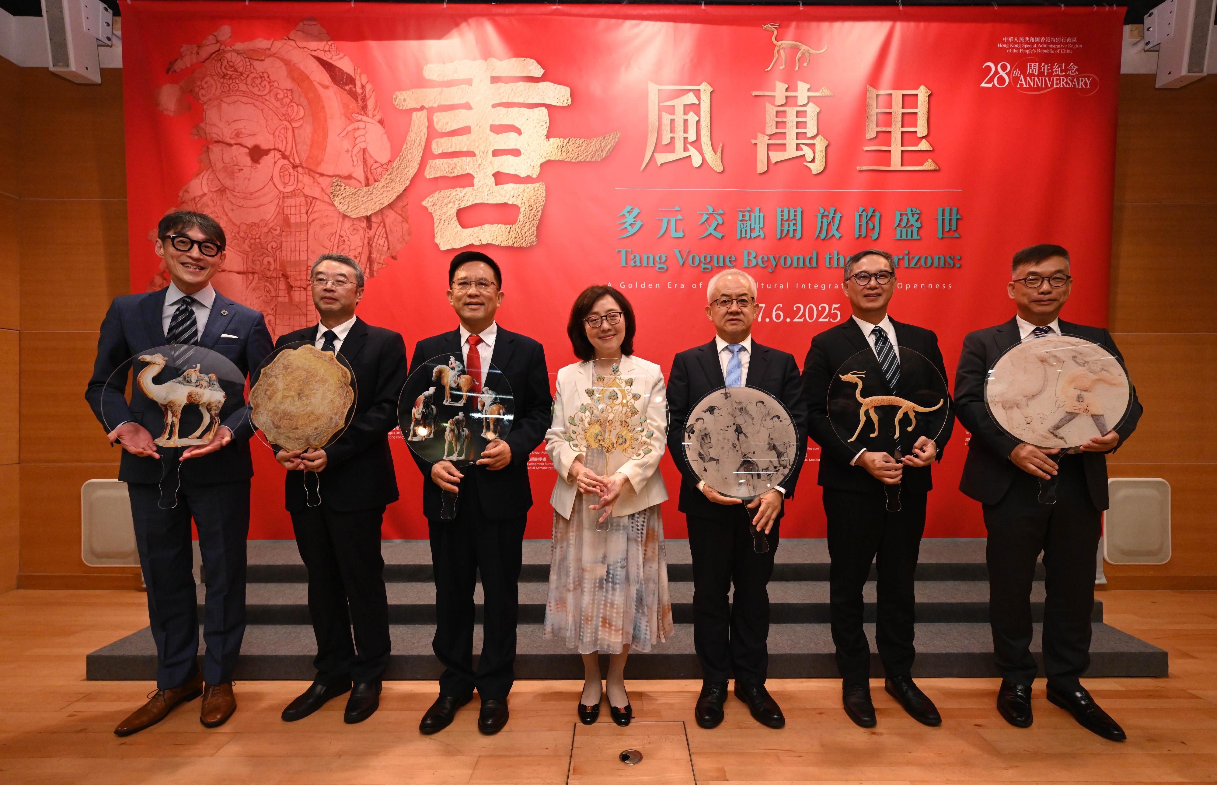 The opening ceremony of the exhibition entitled "Tang Vogue Beyond the Horizons: A Golden Era of Multicultural Integration and Openness" was held today (June 27) at the Hong Kong Heritage Discovery Centre. Photo shows the Secretary for Development, Ms Bernadette Linn (centre); Deputy Administrator of the National Cultural Heritage Administration Mr Qiao Yunfei (third right); the Secretary General of the Liaison Office of the Central People's Government in the Hong Kong Special Administrative Region, Mr Wang Songmiao (third left); the Permanent Secretary for Development (Works), Mr Ricky Lau (second right); the Director of Art Exhibitions China, Mr Tan Ping (second left); the Chairman of the Antiquities Advisory Board, Professor Desmond Hui (first right); and the Chairman of the Advisory Committee on Built Heritage Conservation, Professor Douglas So (first left), officiating at the opening ceremony.