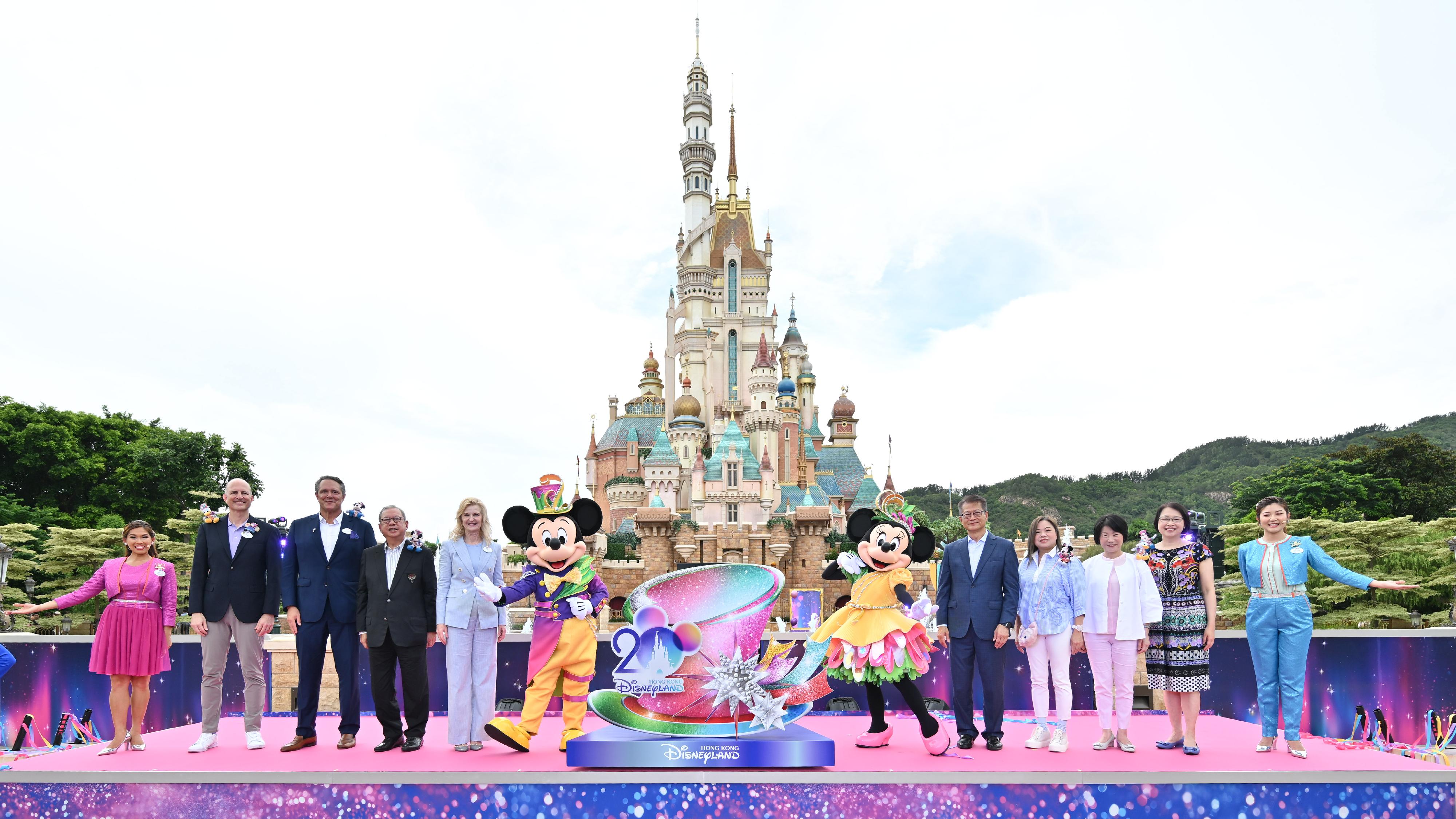 The Financial Secretary, Mr Paul Chan, attended the Hong Kong Disneyland Resort 20th Anniversary Party - The Most Magical Party of All today (June 28). Photo shows Mr Chan (fifth right); the President and Managing Director of Disney Parks International of the Walt Disney Company, Ms Jill Estorino (fifth left), and other guests at the launch ceremony.
