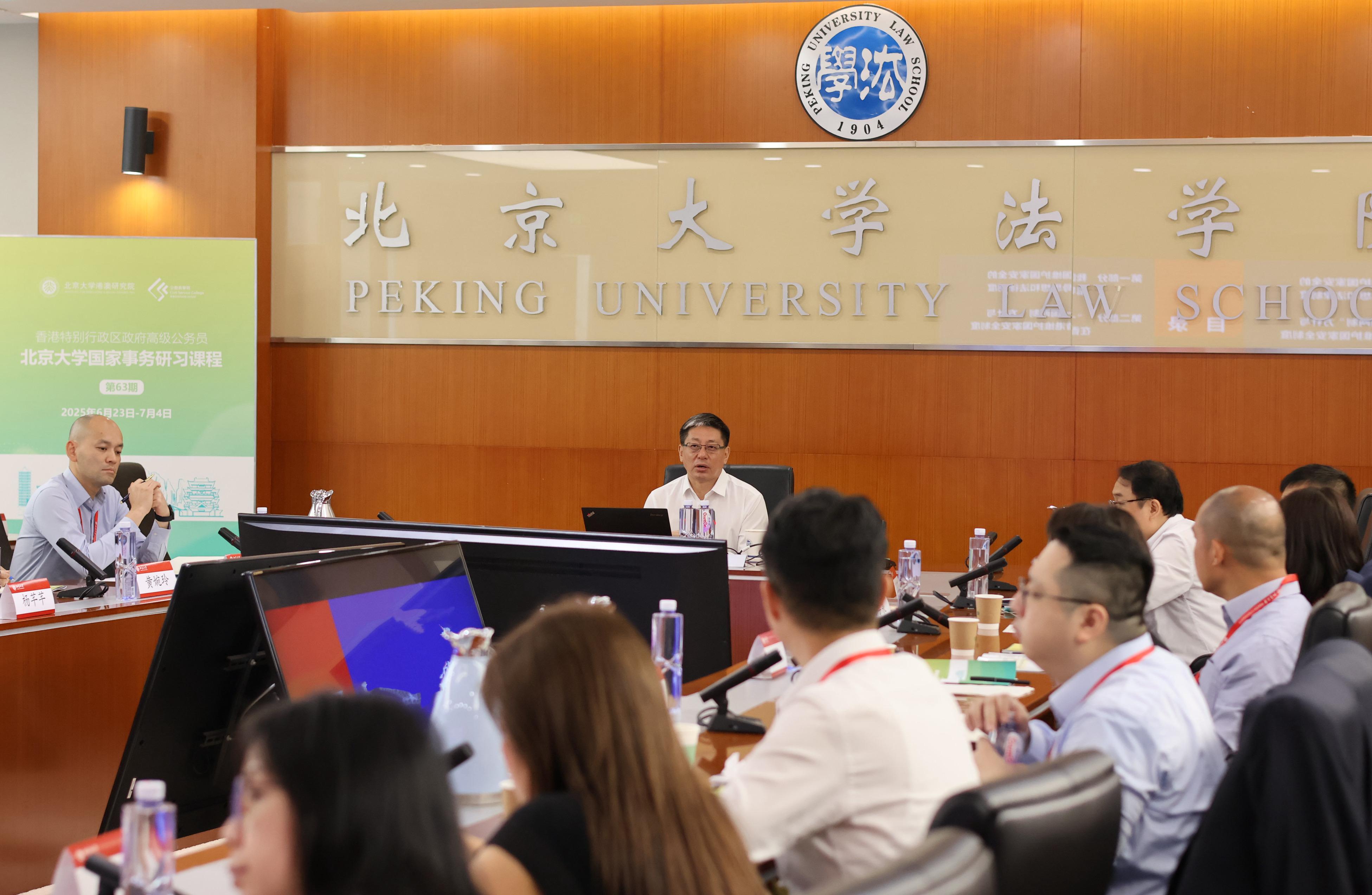 Today (June 30) marks the fifth anniversary of the promulgation and implementation of the Hong Kong National Security Law. Thirty-three senior civil servants of the Hong Kong Special Administrative Region Government who are participating in a national studies programme organised by the Civil Service College and Peking University in Beijing attended a thematic seminar on Hong Kong National Security Law today. Photo shows Deputy Director of the Hong Kong Basic Law Committee and the Macao Basic Law Committee of the Standing Committee of the National People's Congress and Deputy Director of the Legislative Affairs Commission of the Standing Committee of the National People's Congress, Mr Zhang Yong (centre), delivering a talk.
