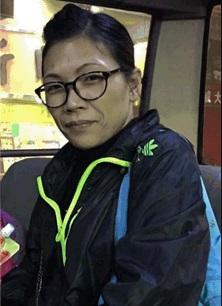 Lui Hoi-yan, aged 48, is about 1.65 metres tall, 60 kilograms in weight and of medium build. She has a pointed face with yellow complexion and long curly hair.