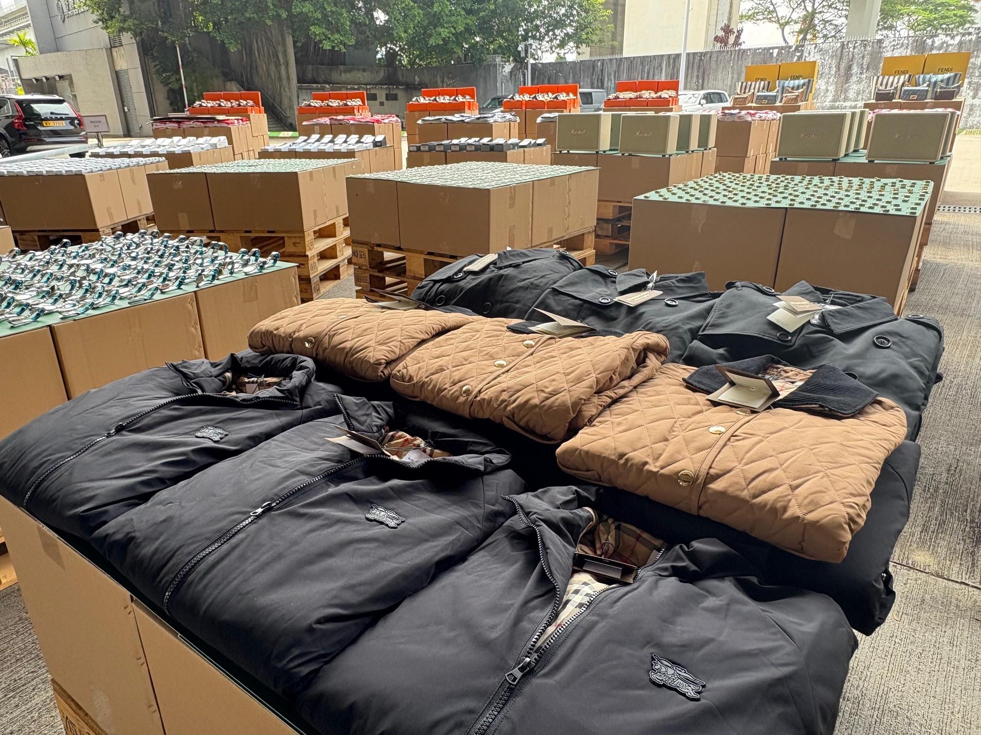 Hong Kong Customs conducted a four-week enforcement operation codenamed "Ocean Shield" from May 28 to June 27 to combat counterfeit and infringing goods activities involving cross-boundary transshipments by sea cargo and local deliveries. During the operation, Customs detected 36 related cases and seized about 157 000 items of suspected counterfeit goods with an estimated market value of over $72 million. Photo shows some of the suspected counterfeit clothing seized.
