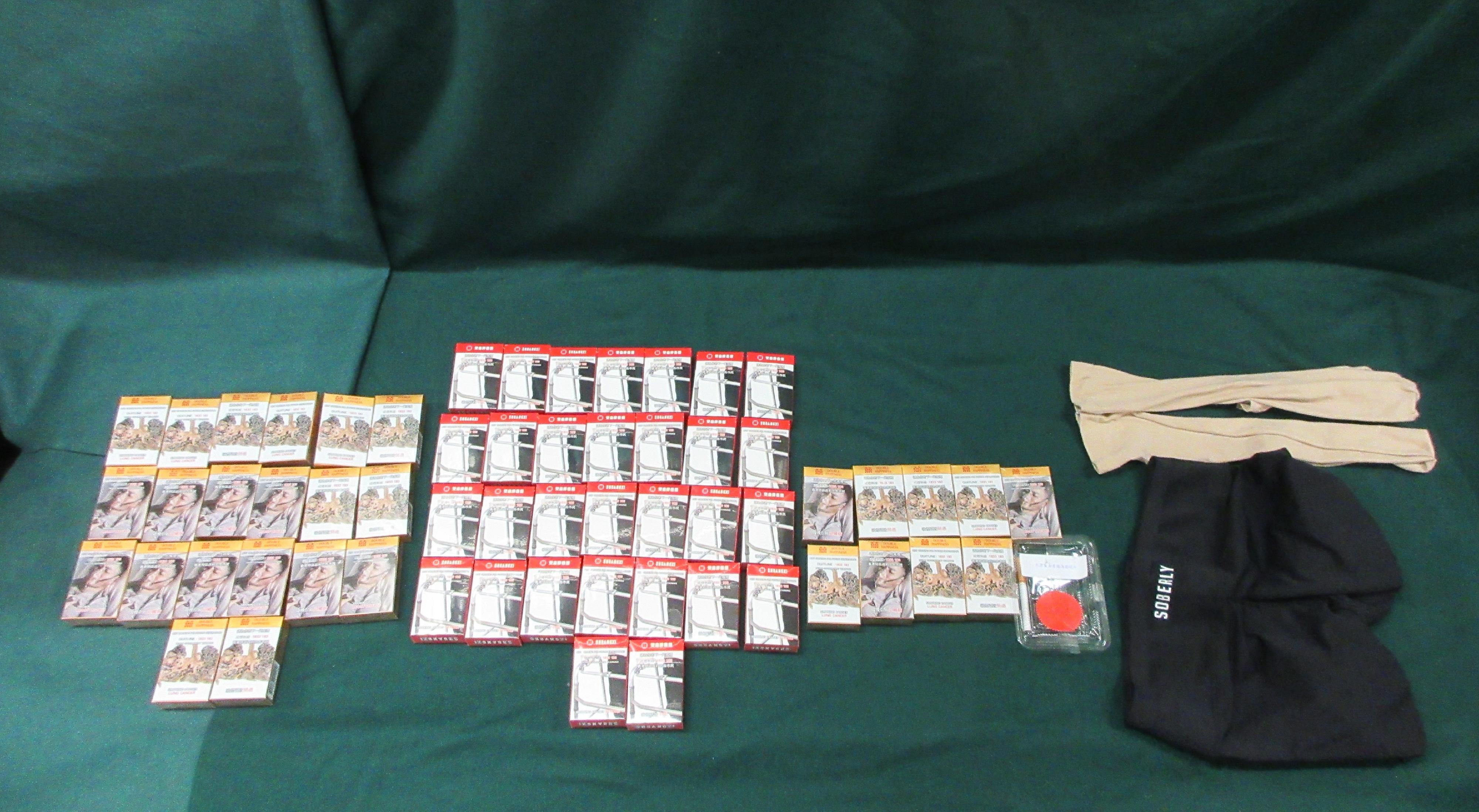 An incoming 64-year-old male passenger was sentenced to three months' imprisonment with a fine of $1,200 at the Fanling Magistrates' Courts today (July 4) for possessing duty-not-paid cigarettes and failing to declare them to Customs Officers at the Lo Wu Control Point, in contravention of the Dutiable Commodities Ordinance. Photo shows the duty-not-paid cigarettes seized.
