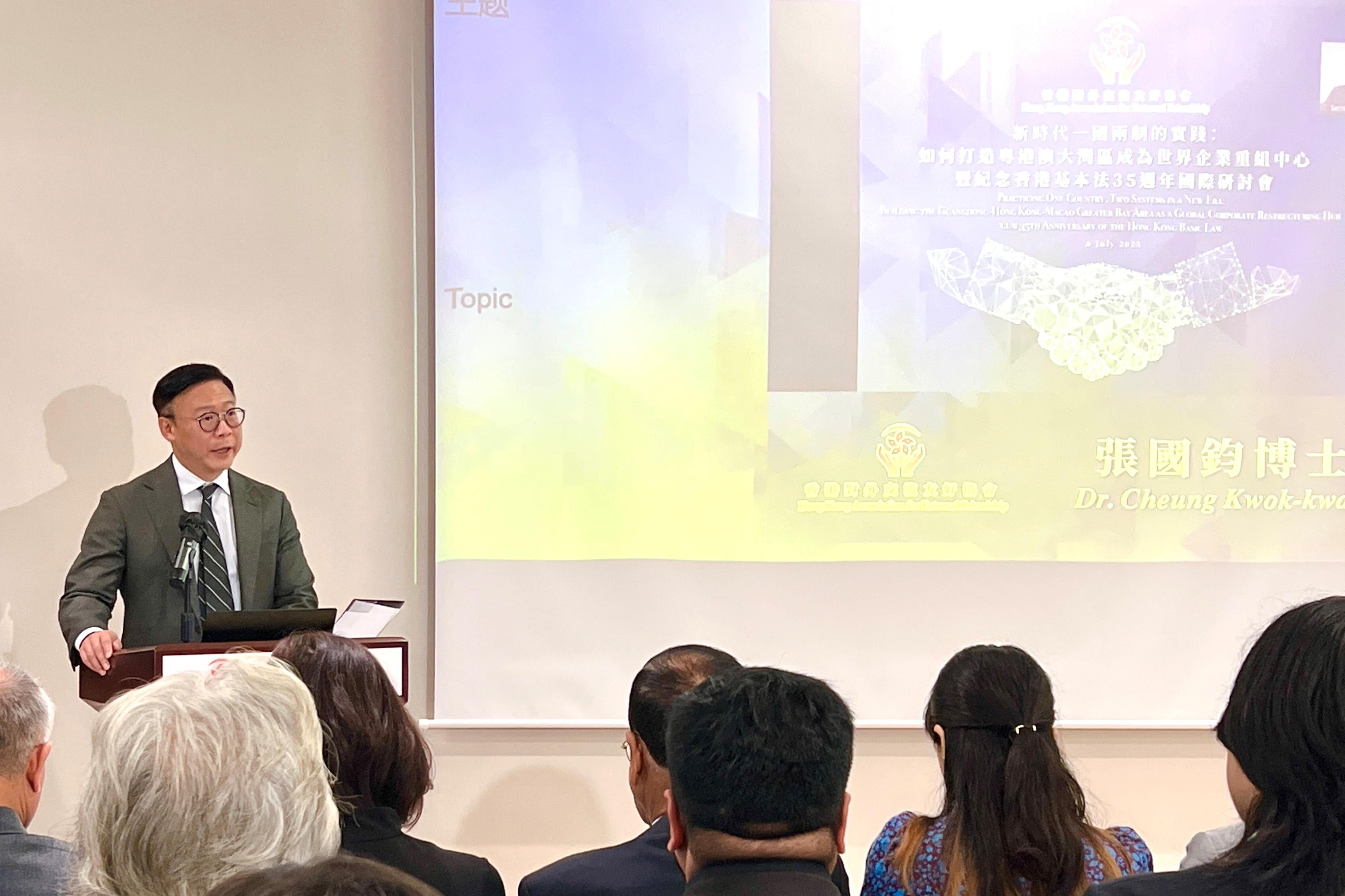 The Deputy Secretary for Justice, Dr Cheung Kwok-kwan, delivers opening remarks at the International Symposium on Global Corporate Restructuring Center today (July 6).