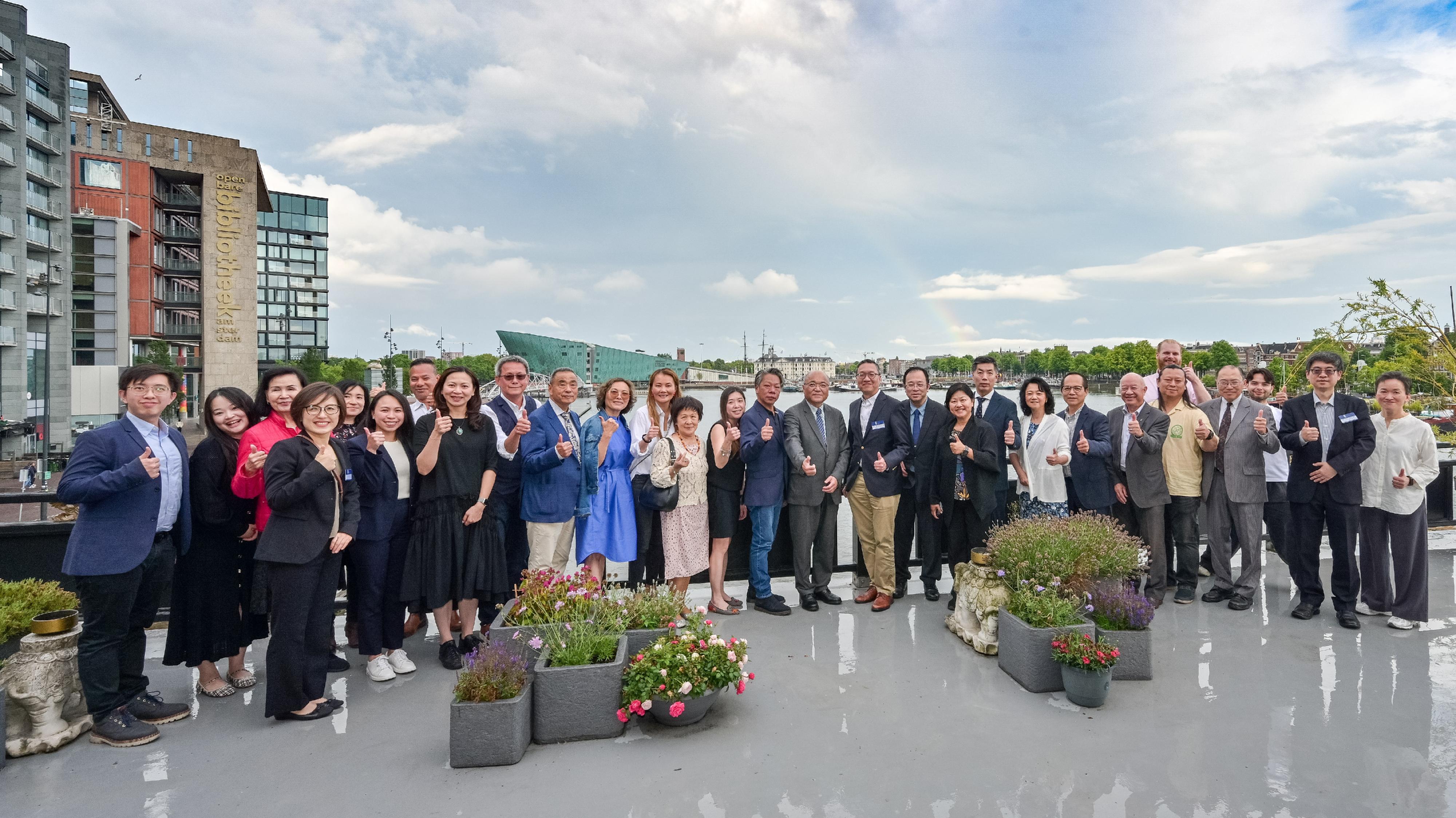 The Secretary for Justice, Mr Paul Lam, SC, began his European visit in Amsterdam, the Netherlands, on July 6 (Amsterdam time). Photo shows Mr Lam (13th right); the Law Officer (International Law) of the Department of Justice, Dr James Ding (second right); and the Special Representative for Hong Kong Economic and Trade Affairs to the European Union, Ms Shirley Yung (11th right), with Hong Kong and Mainland people and overseas Chinese organisation representatives living in the Netherlands and Luxembourg after a dinner.
