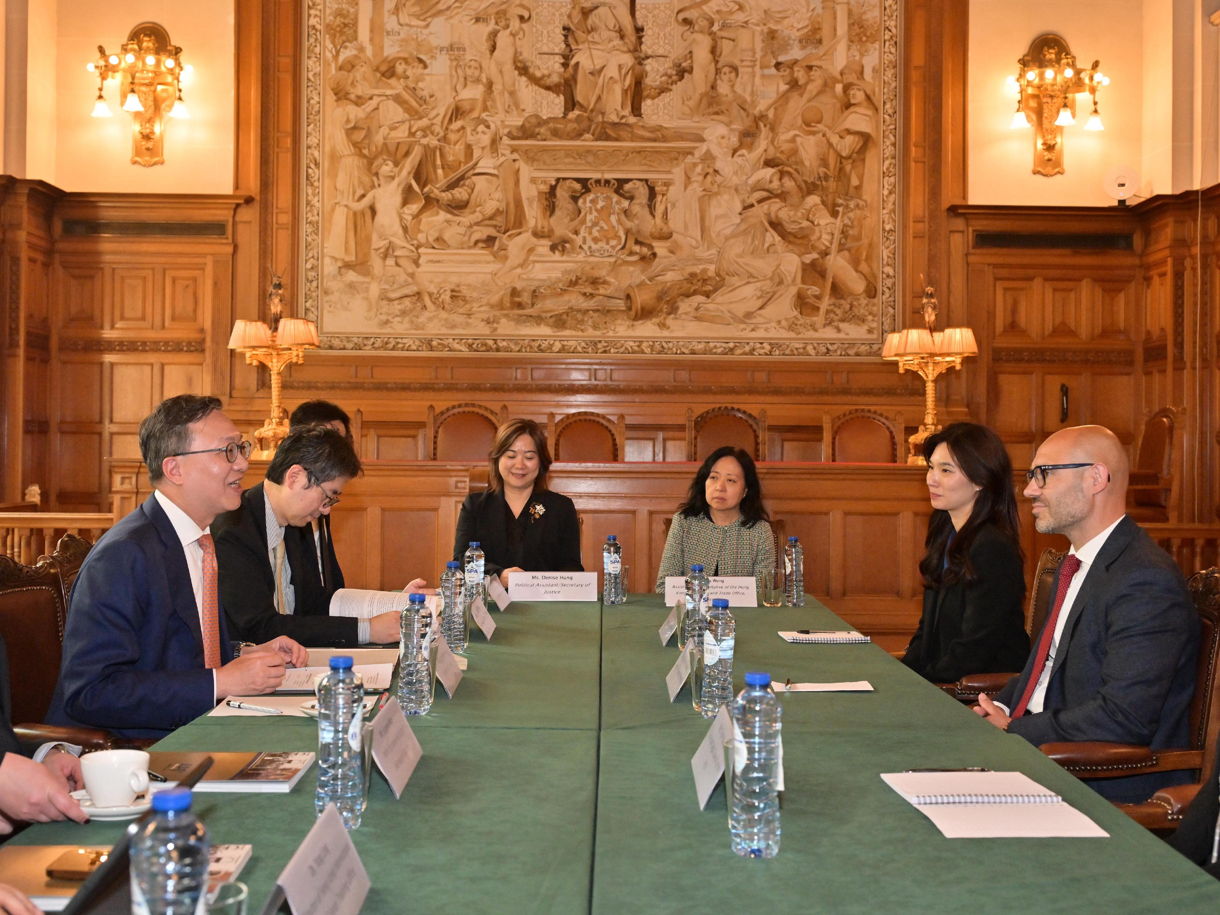 The Secretary for Justice, Mr Paul Lam, SC, visited the Permanent Court of Arbitration (PCA) on July 7 (The Hague time). Photo shows Mr Lam (first left) and the Law Officer (International Law) of the Department of Justice, Dr James Ding (second left) meeting with the Secretary-General of the PCA, Dr Marcin Czepelak (first right).