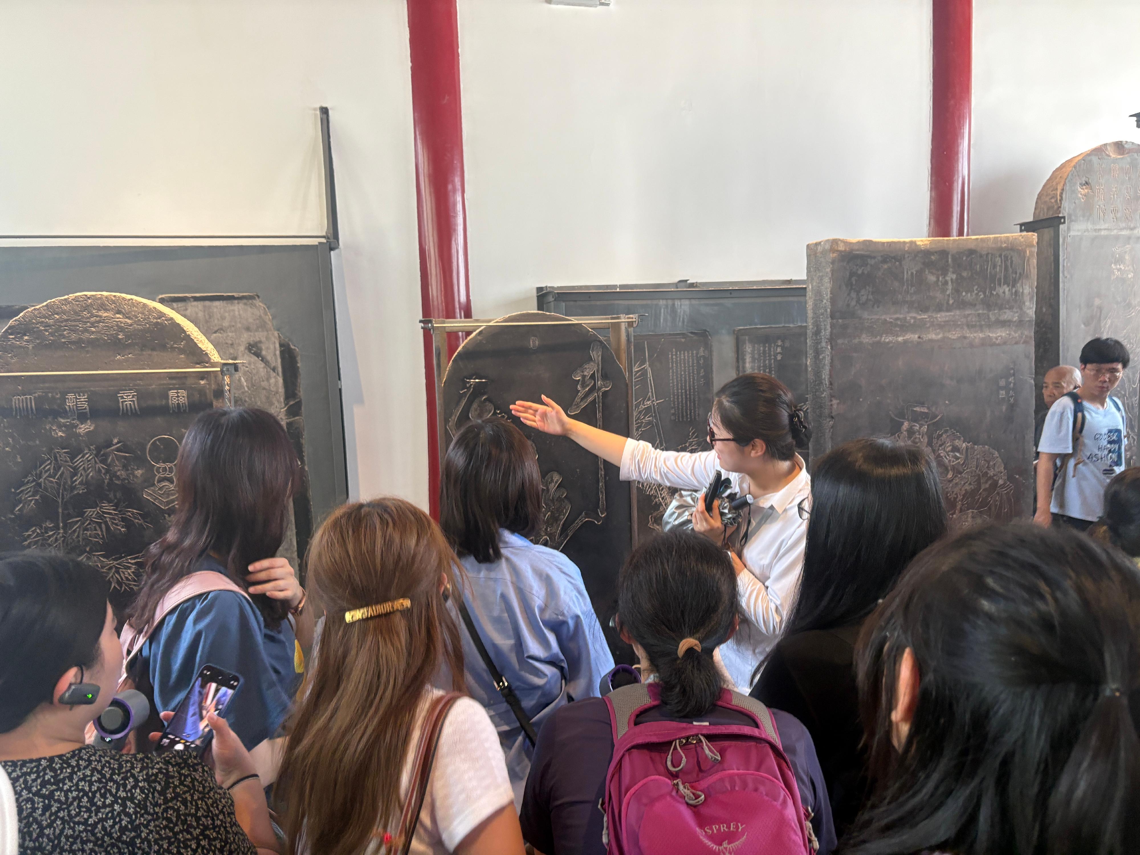 The teacher study tour to Shaanxi on the ancient civilisation of the Qin and Han dynasties, co-organised by the Chinese Culture Promotion Office of the Leisure and Cultural Services Department and the Education Bureau, led 23 secondary school Chinese history teachers to visit various major museums and cultural institutions in Xi'an from June 27 to July 1. Photo shows the study tour visiting the Xi'an Beilin Museum. 
