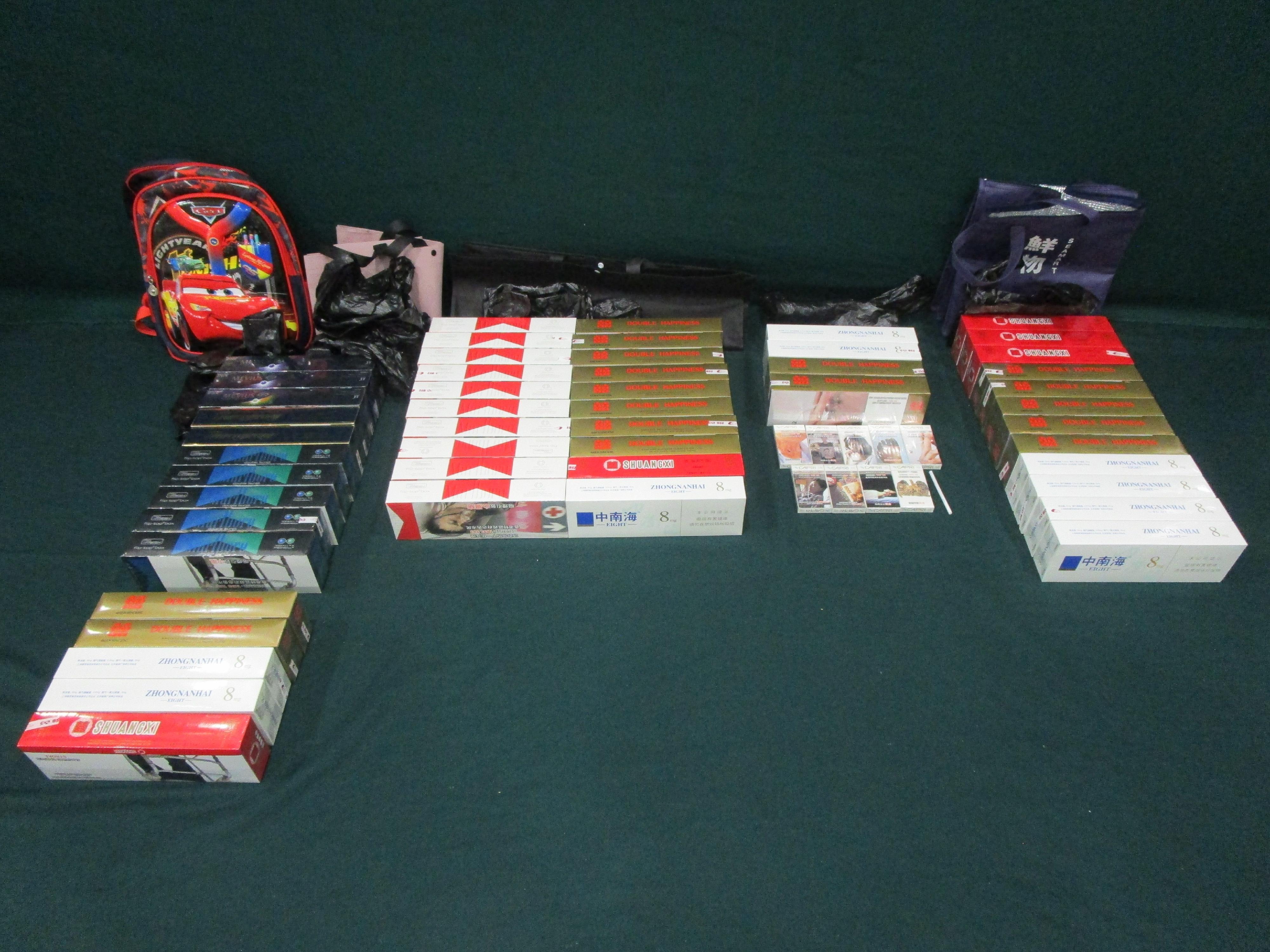An incoming 36-year-old female passenger was sentenced to two months' imprisonment at the Fanling Magistrates' Courts today (July 9) for possessing duty-not-paid cigarettes and failing to declare to Customs Officers, in contravention of the Dutiable Commodities Ordinance. Photo shows the duty-not-paid cigarettes seized.
