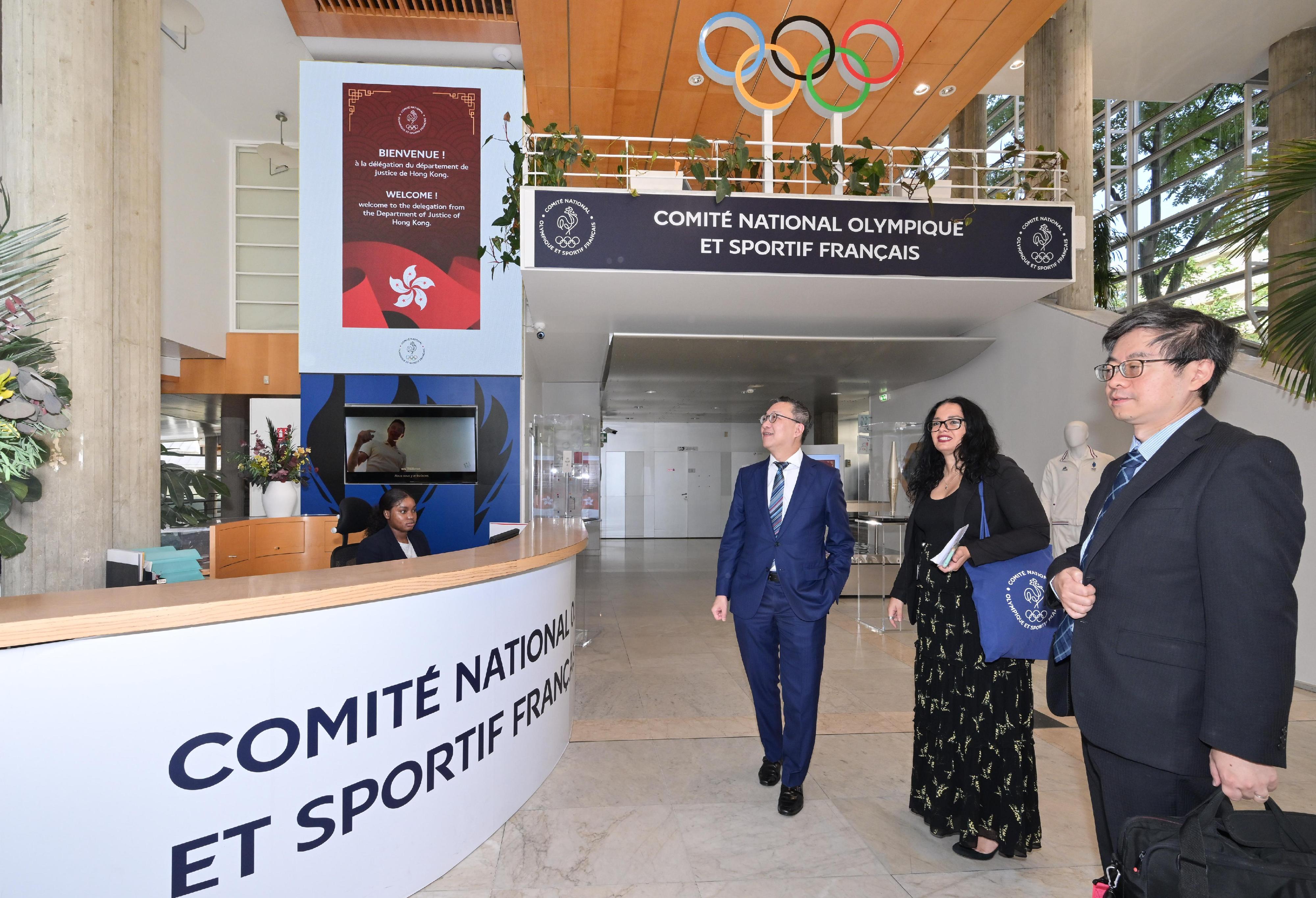 The Secretary for Justice, Mr Paul Lam, SC, visited the French National and Olympic Sports Committee (CNOSF) on July 9 (Paris time). Photo shows Mr Lam (third right) and the Law Officer (International Law) of the Department of Justice, Dr James Ding (first right) touring the CNOSF.
