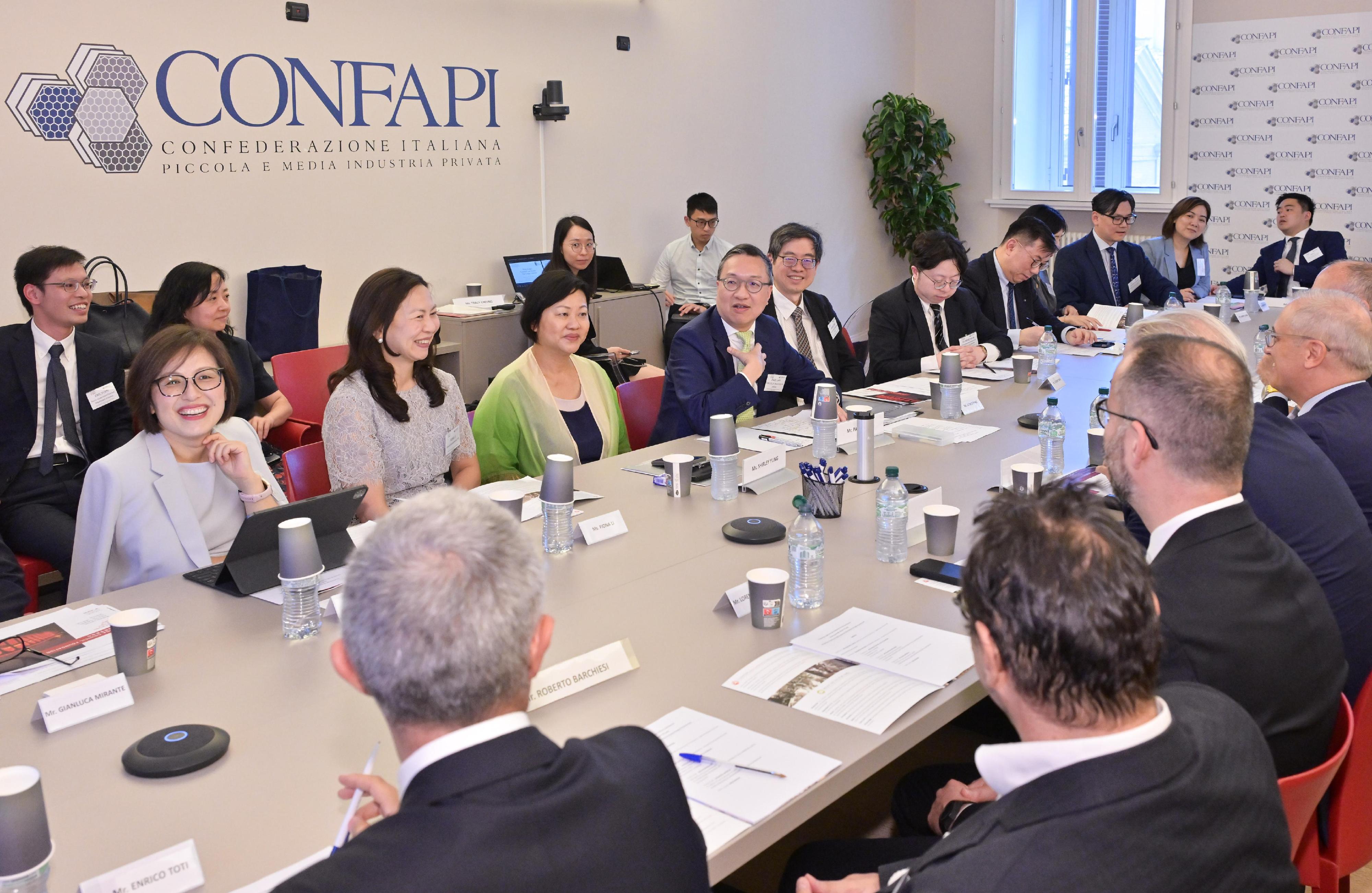 The Secretary for Justice, Mr Paul Lam, SC (fourth left); the Law Officer (International Law) of the Department of Justice (DoJ), Dr James Ding (fifth left); and the Director of the Hong Kong International Legal Talents Training Office of the DoJ, Dr Yang Ling (first left), attended a meeting hosted by the Italy China Council Foundation and supported by the Italian confederation of small and medium private industries in Rome, Italy on July 11 (Rome time), and introduced to the participants the advantages of Hong Kong's legal and dispute resolution services.