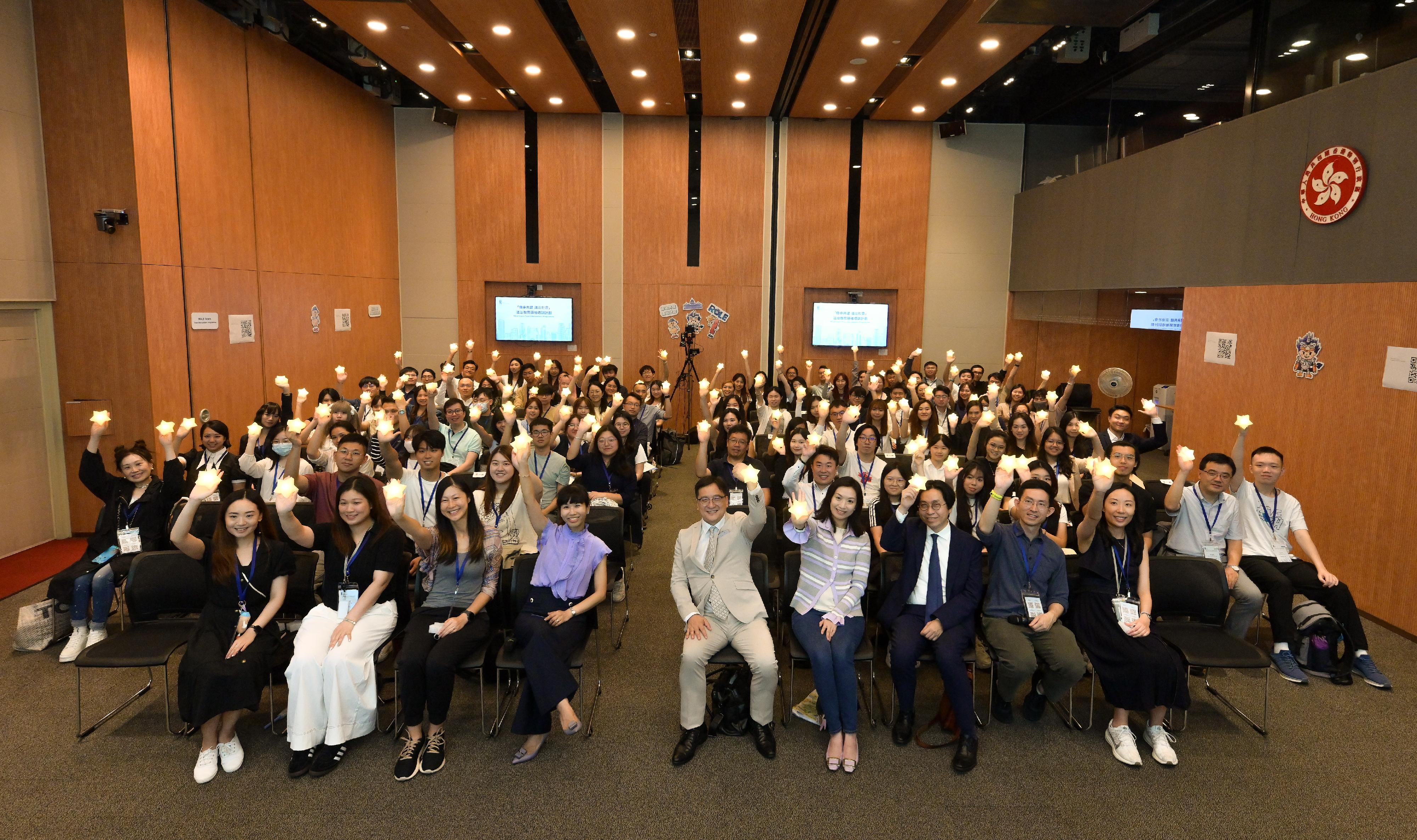 "Rule of Law Education Stars", a two-day foundation course of the third phase of the Rule of Law Education Stars Train-the-Leaders Programme organised by the Department of Justice (DoJ), was concluded today (July 12). Photo shows member of the Steering Committee on Rule of Law Education, Ms Sabrina Ho (first row, fourth right) and Professor Dicky Tsang (first row, third right); member of the Working Group on Coordination and Liaison under the Steering Committee on Rule of Law Education, Mr Chan Chak-ming (first row, fifth right); and Principal Government Counsel of the Legal Enhancement and Development Office of the DoJ Ms Peggy Au-yeung (first row, fourth left), and other guests with trainees at the graduation ceremony.