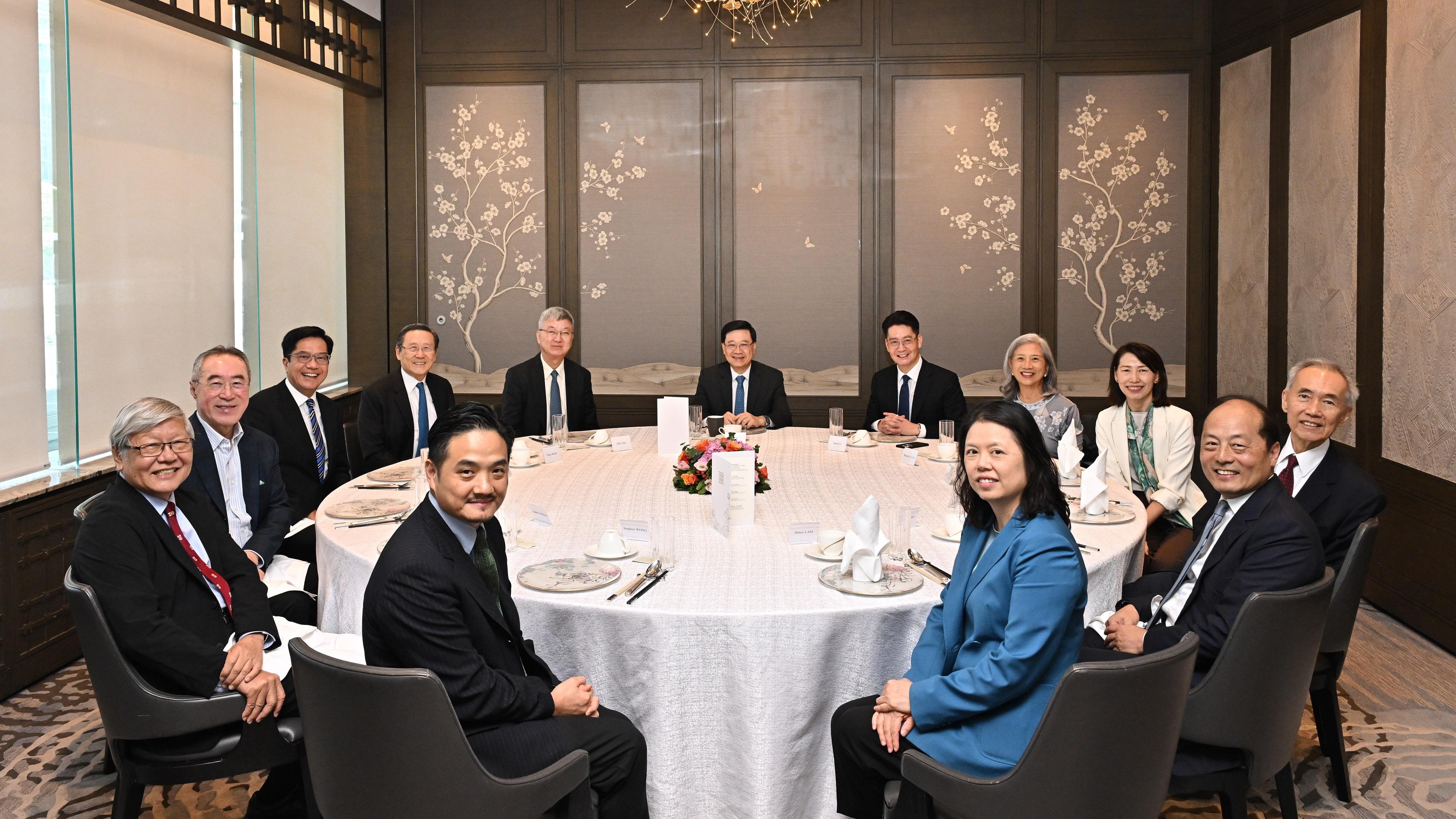 The Chief Executive, Mr John Lee, hosted luncheon meetings of the Chief Executive's Council of Advisers (CECA) to listen to views expressed by CECA members for the forthcoming Policy Address. Photo shows the first session held on July 9.
